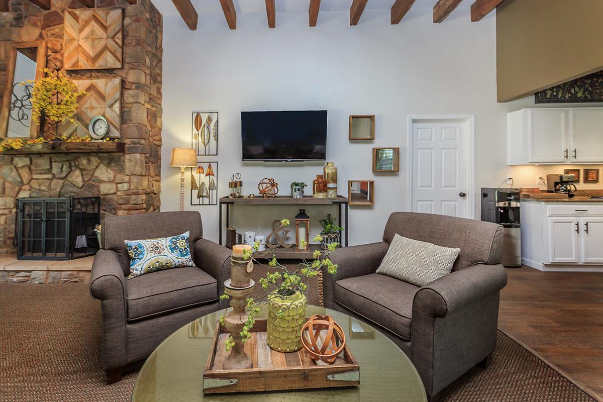 a living room filled with furniture and a fire place