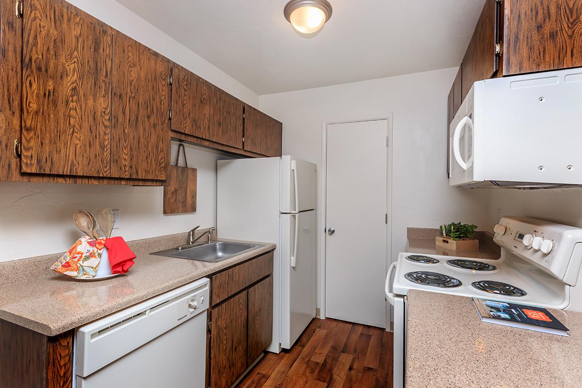 a kitchen with a stove top oven sitting inside of a refrigerator