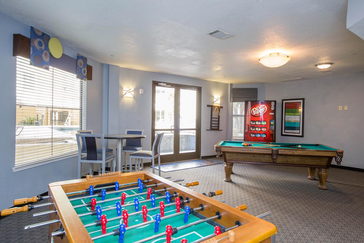 a room filled with furniture and a pool table