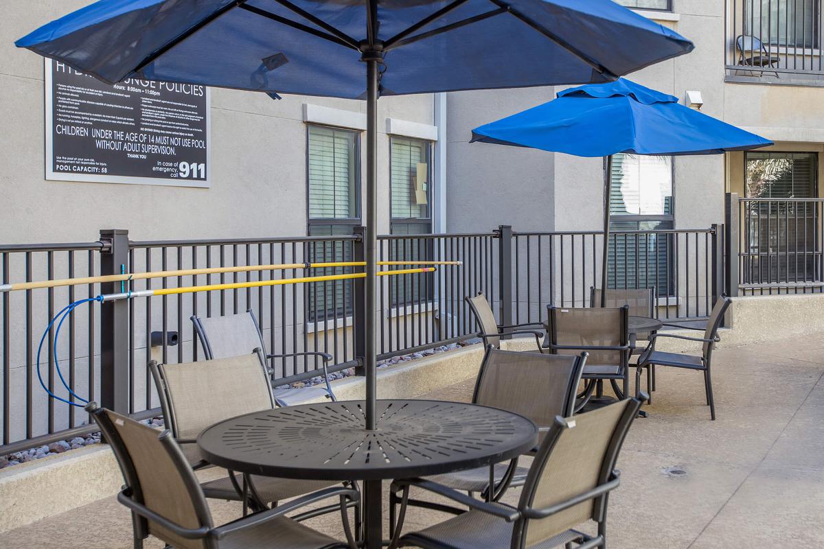 a table topped with a blue umbrella