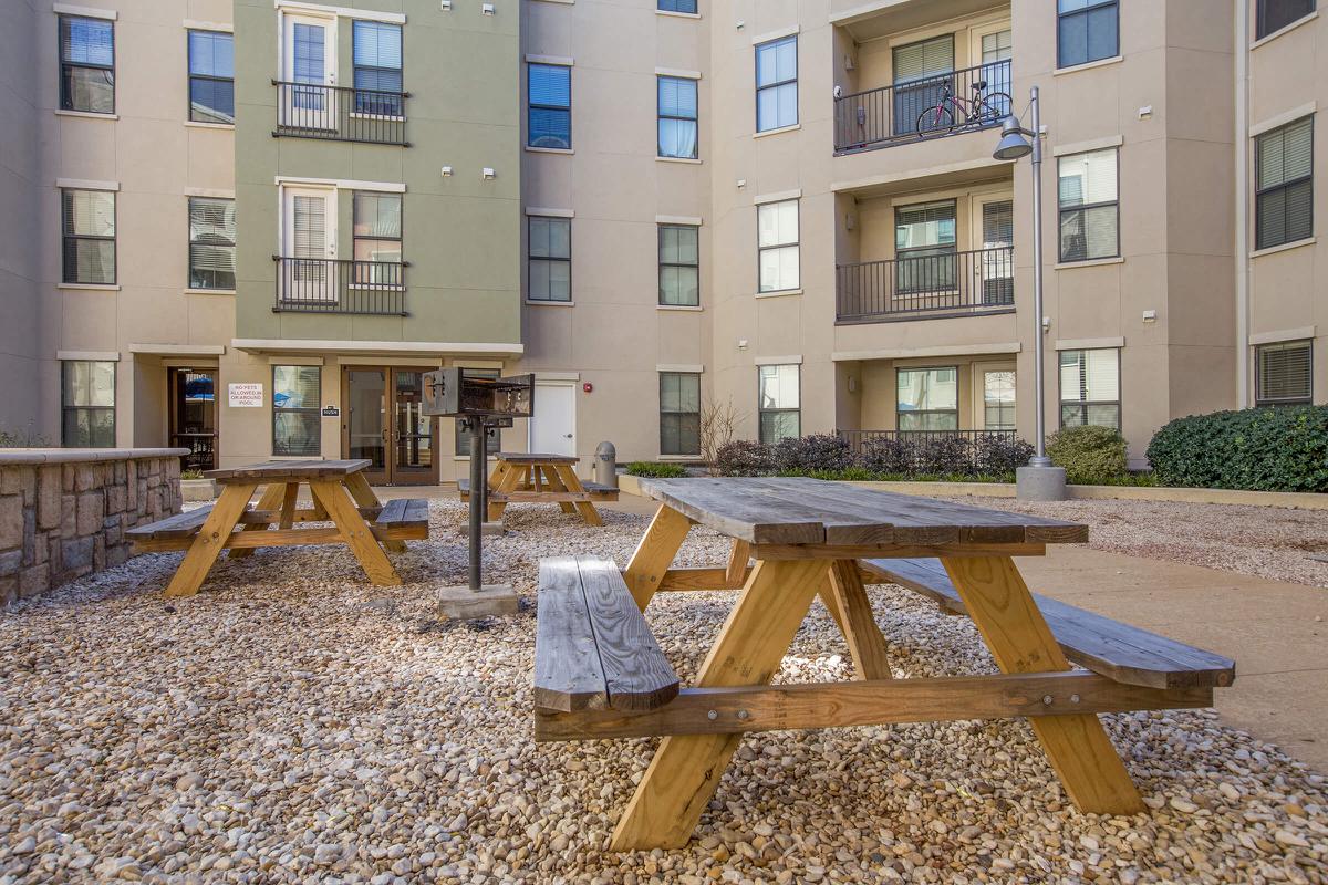 a wooden bench in front of a building