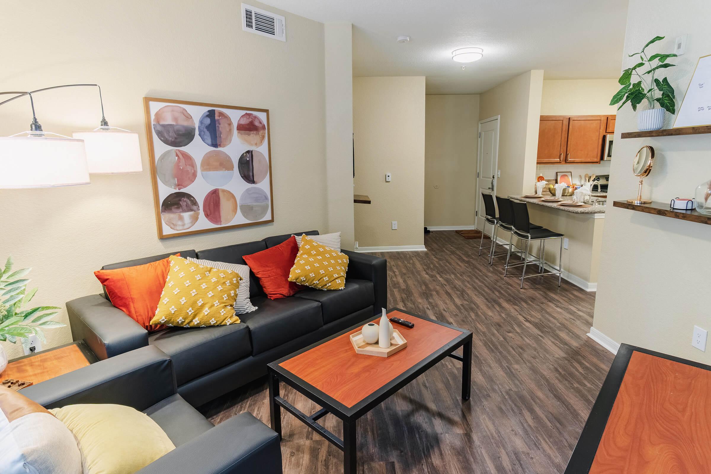 a living room filled with furniture and a table