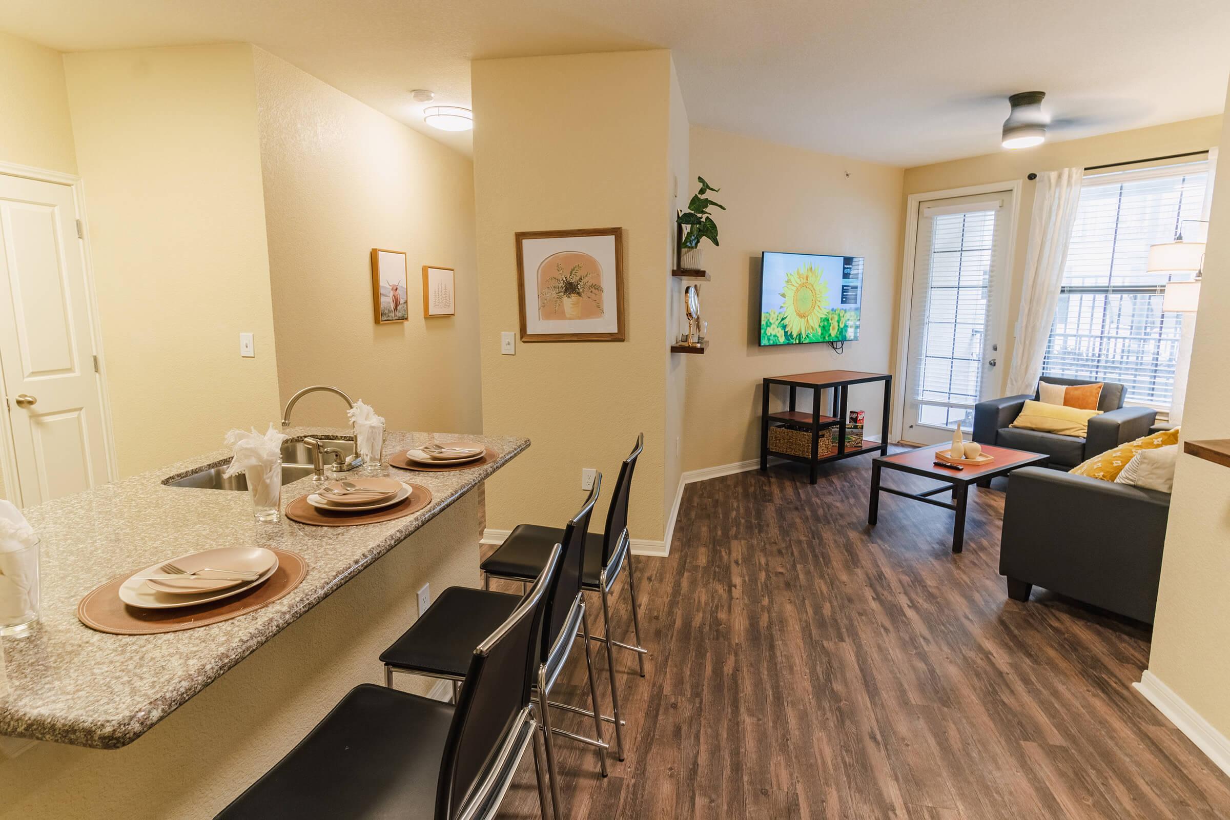 a room filled with furniture and a sink