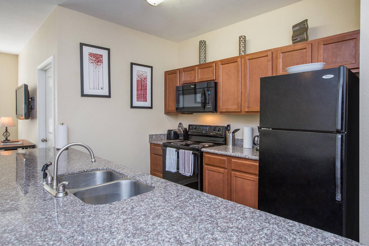 a large kitchen with stainless steel appliances