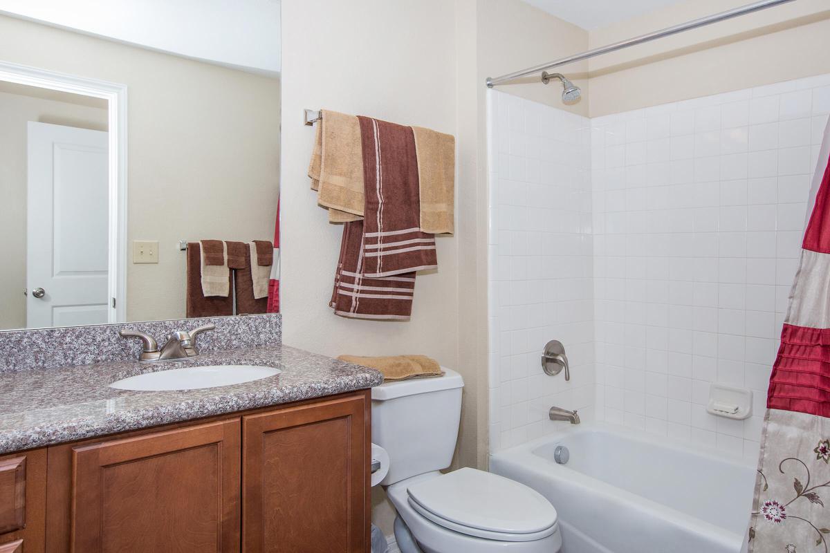 a kitchen with a sink and a shower