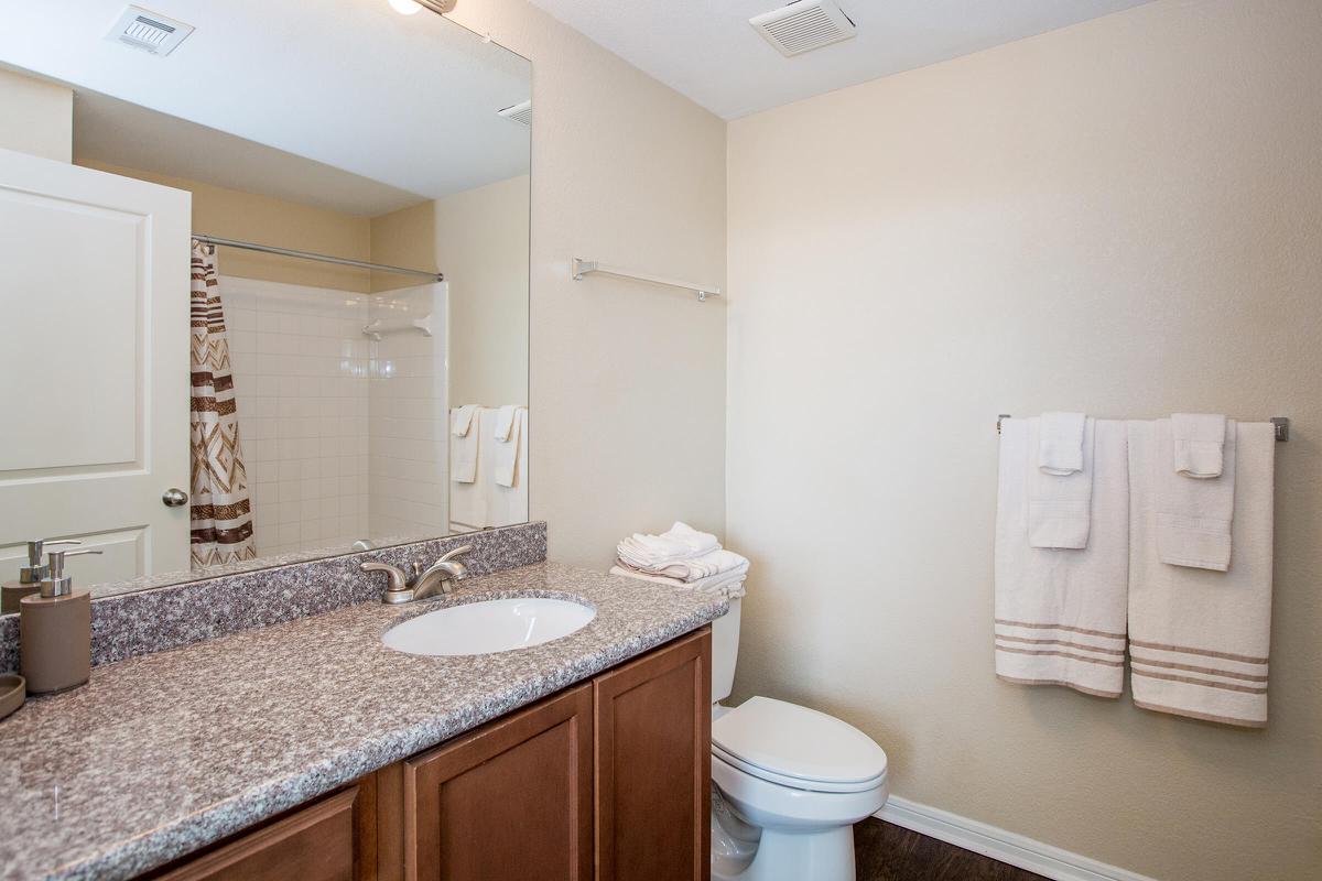 a kitchen with a sink and a mirror