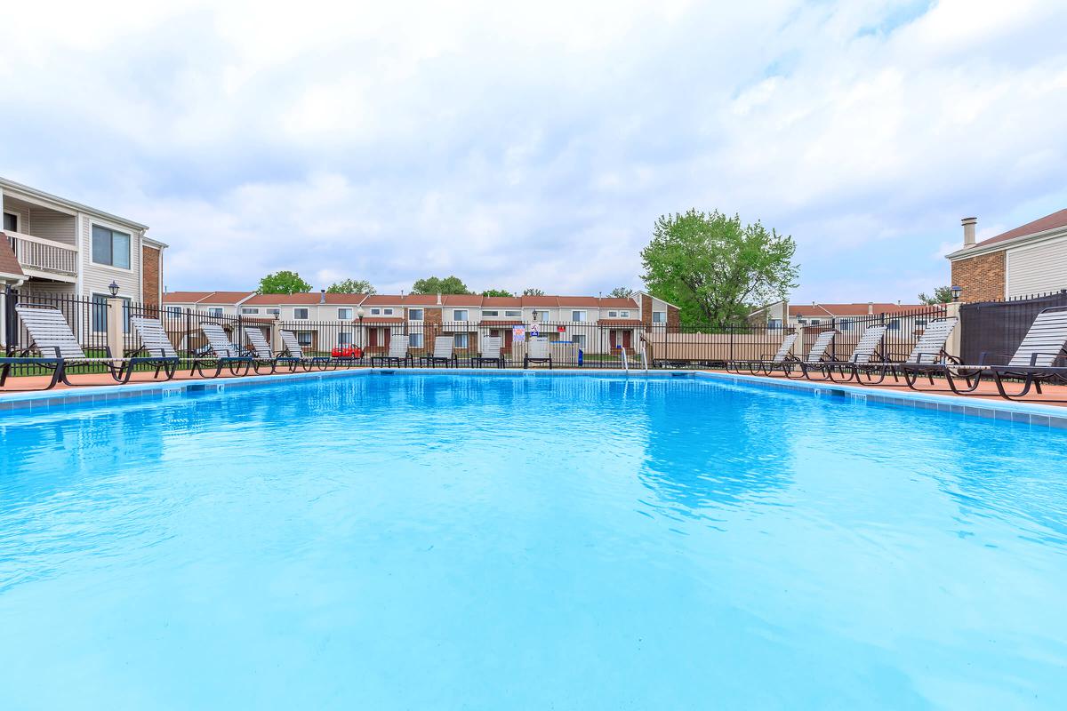 a pool next to a body of water