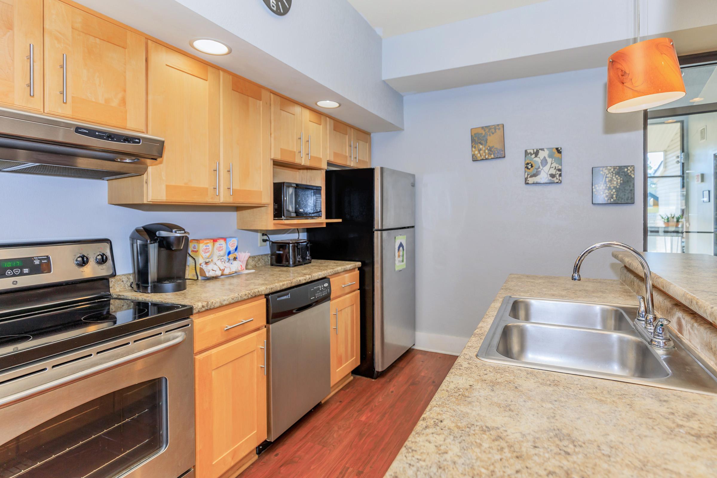 a kitchen with a stove top oven