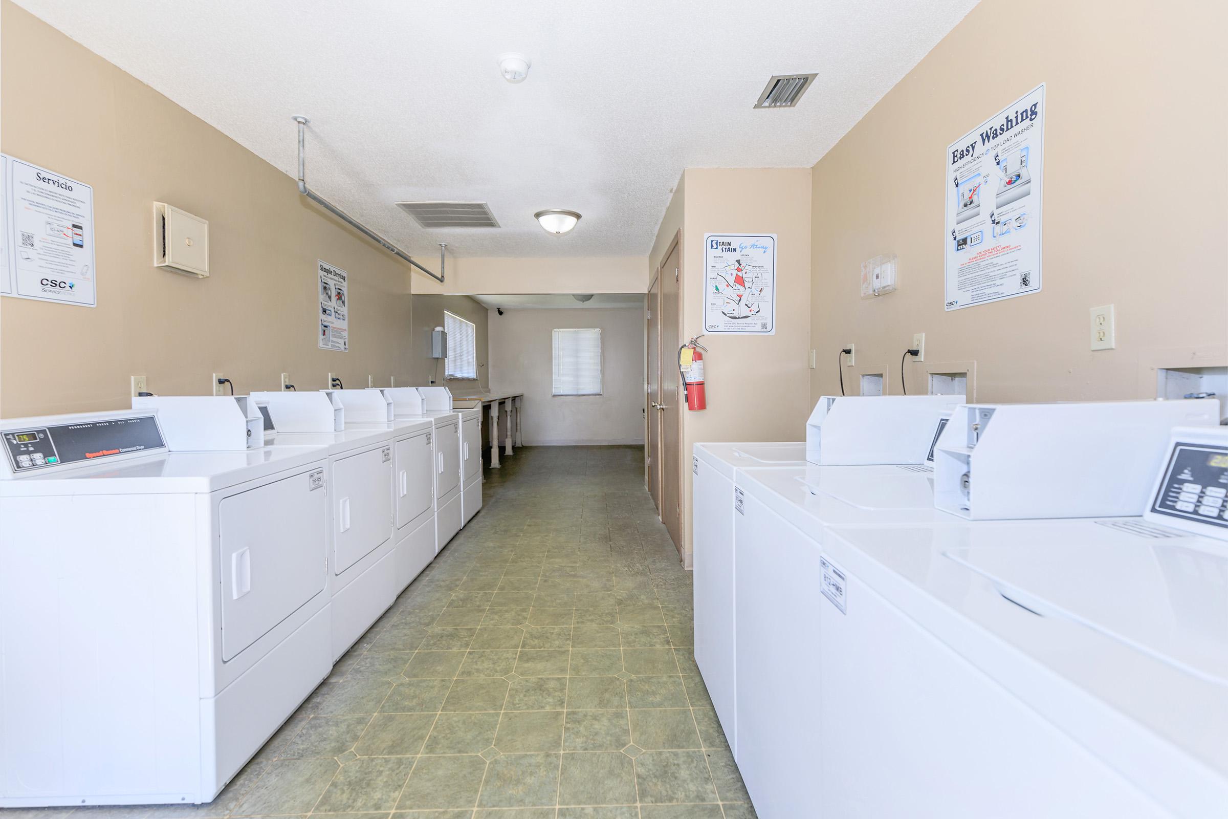 a kitchen with a sink and a refrigerator