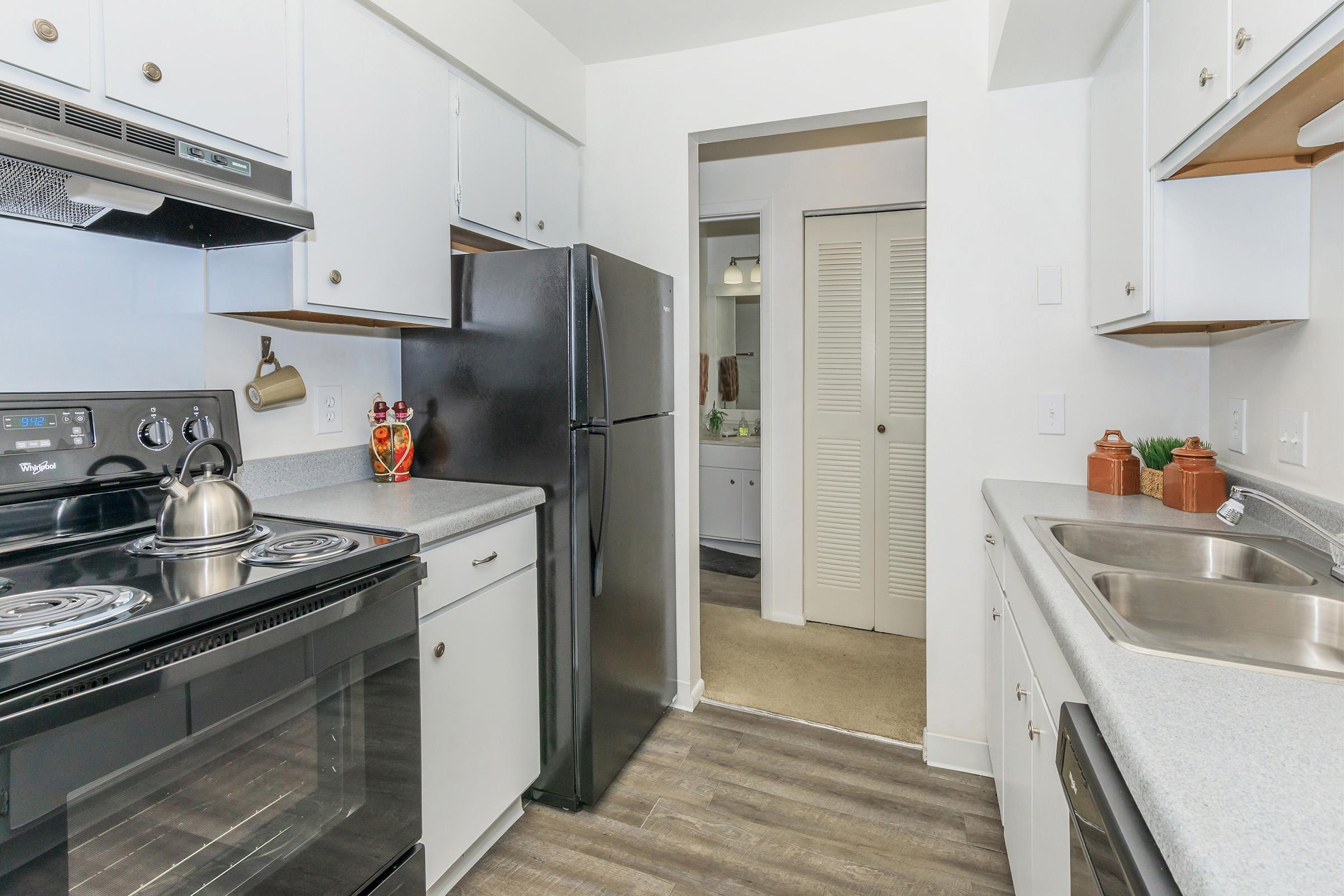 a kitchen with a stove and a sink