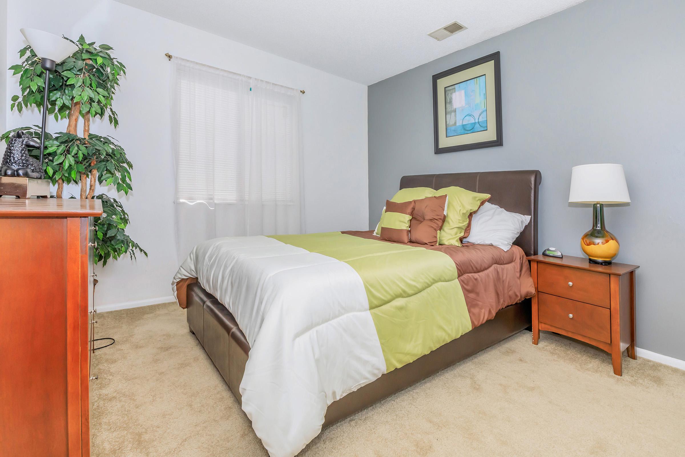 a bedroom with a large bed in a room