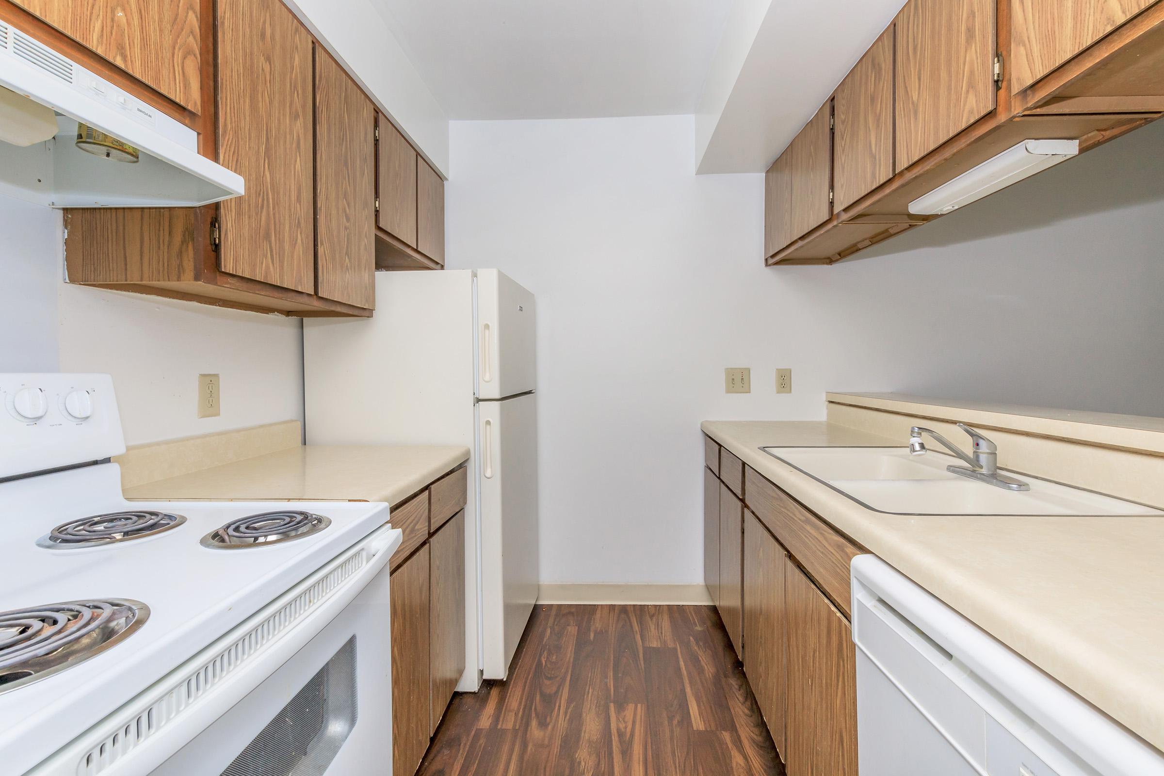 a kitchen with a stove top oven sitting inside of a refrigerator