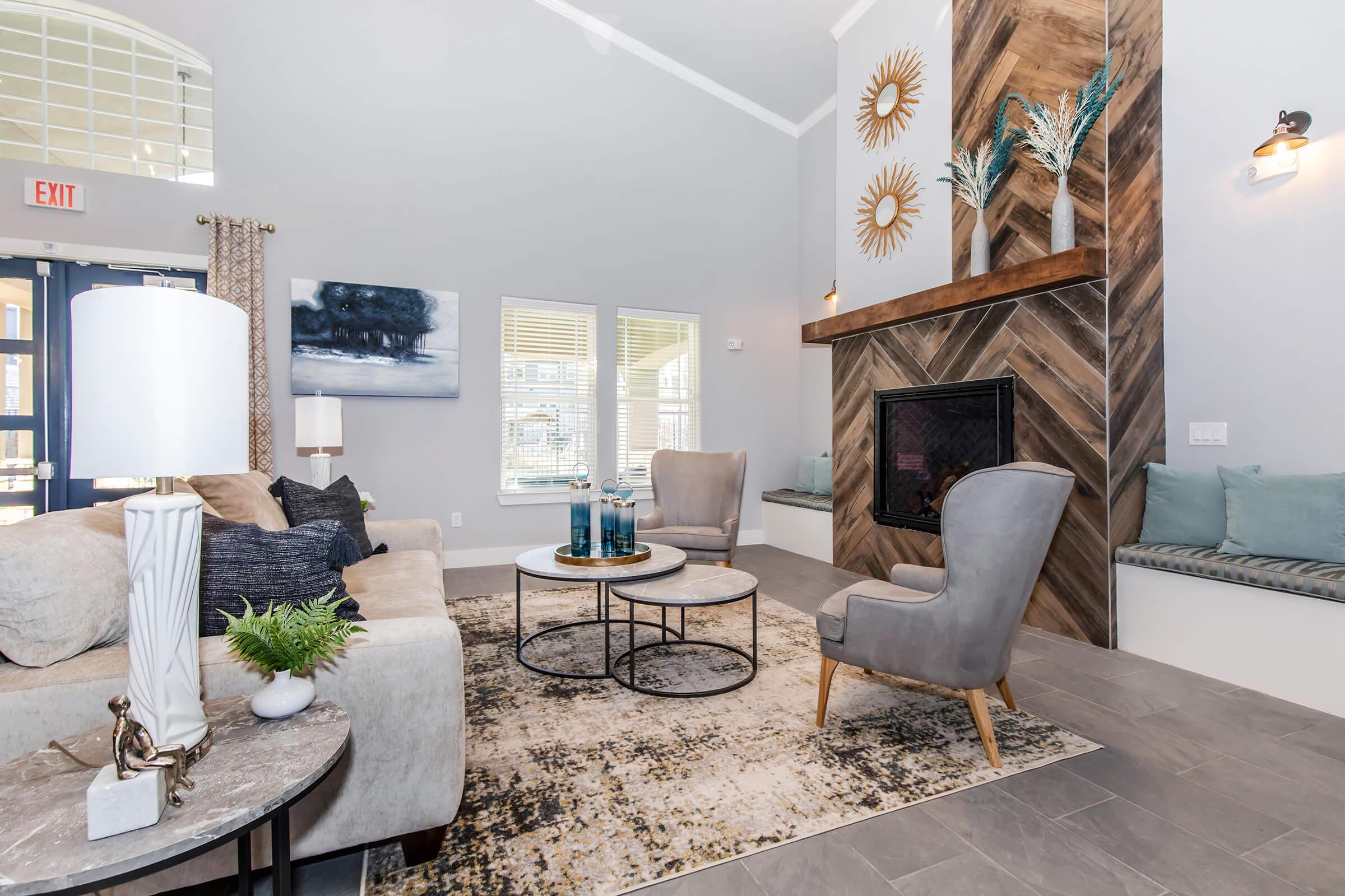 a living room filled with furniture and a fireplace