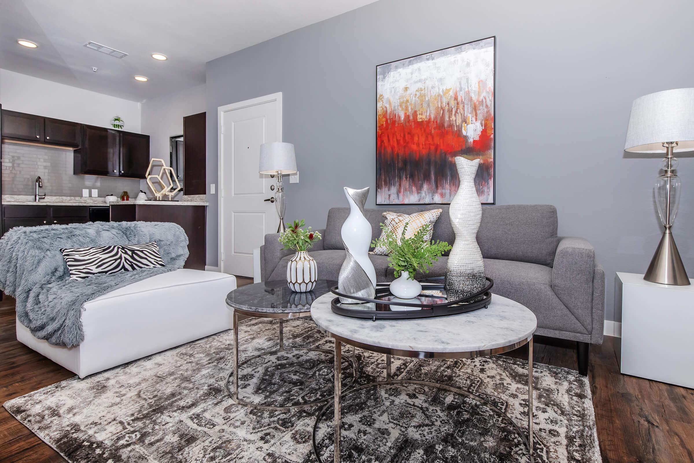 a living room filled with furniture and a flat screen tv