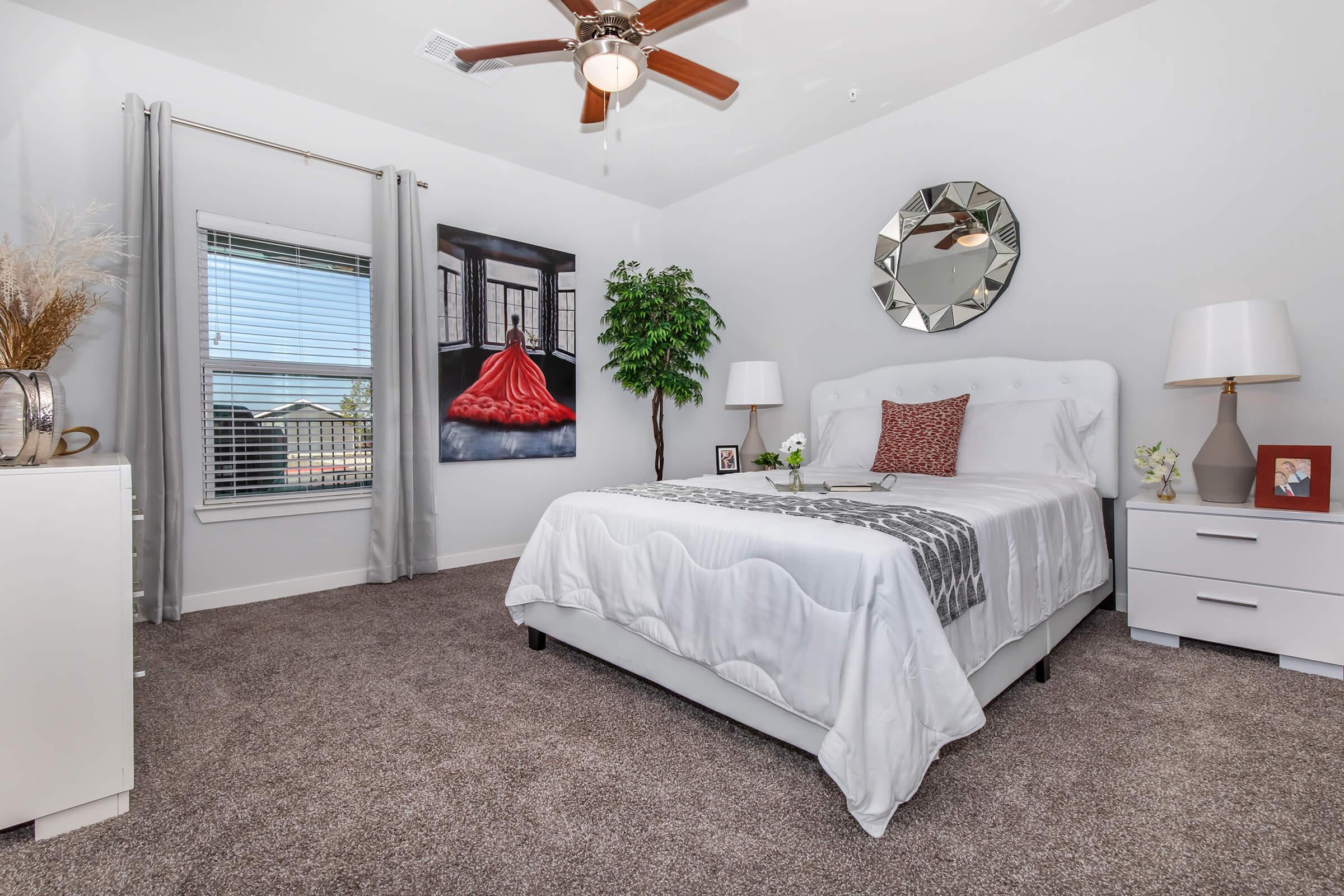 a bedroom with a large bed in a room