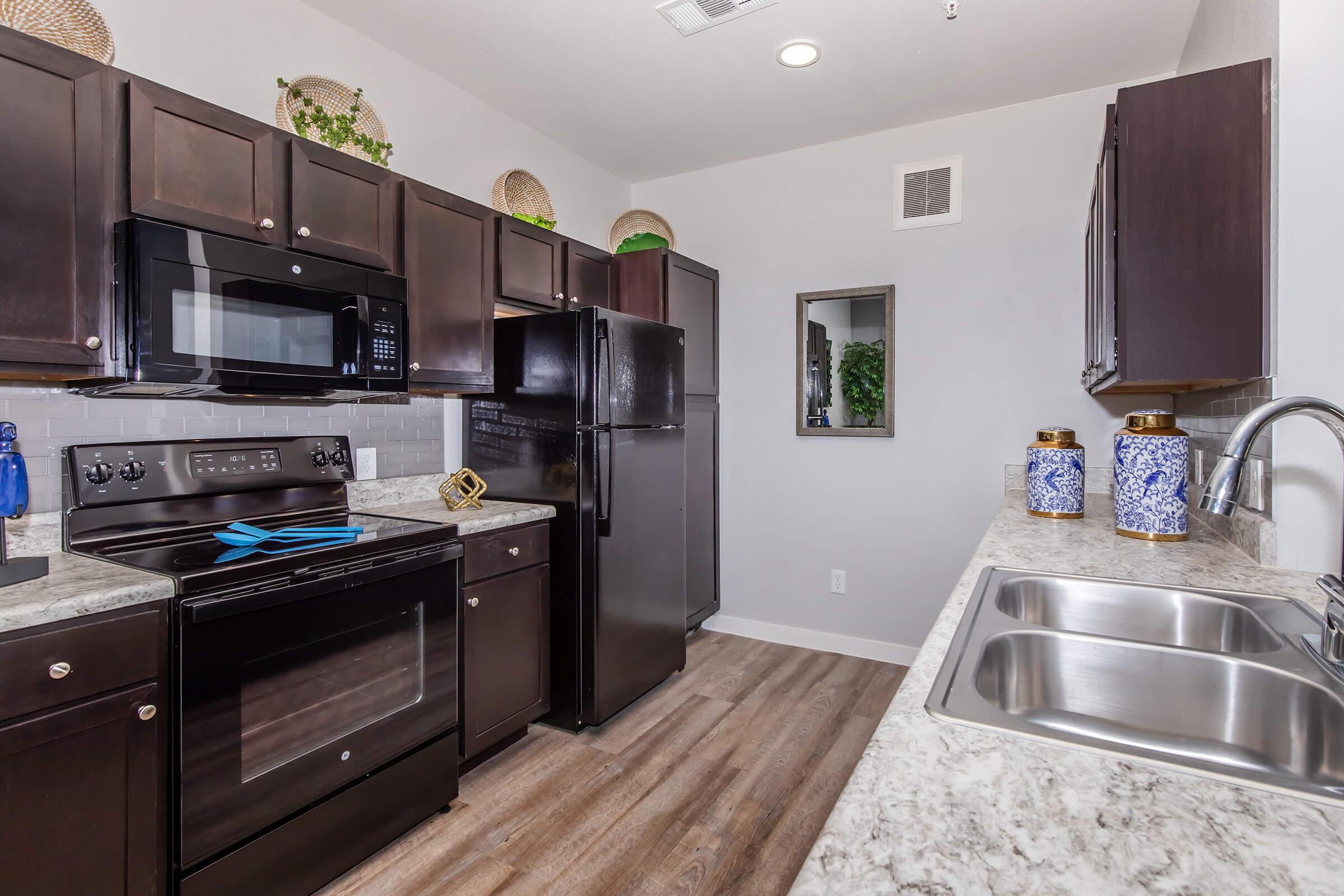 a modern kitchen with stainless steel appliances