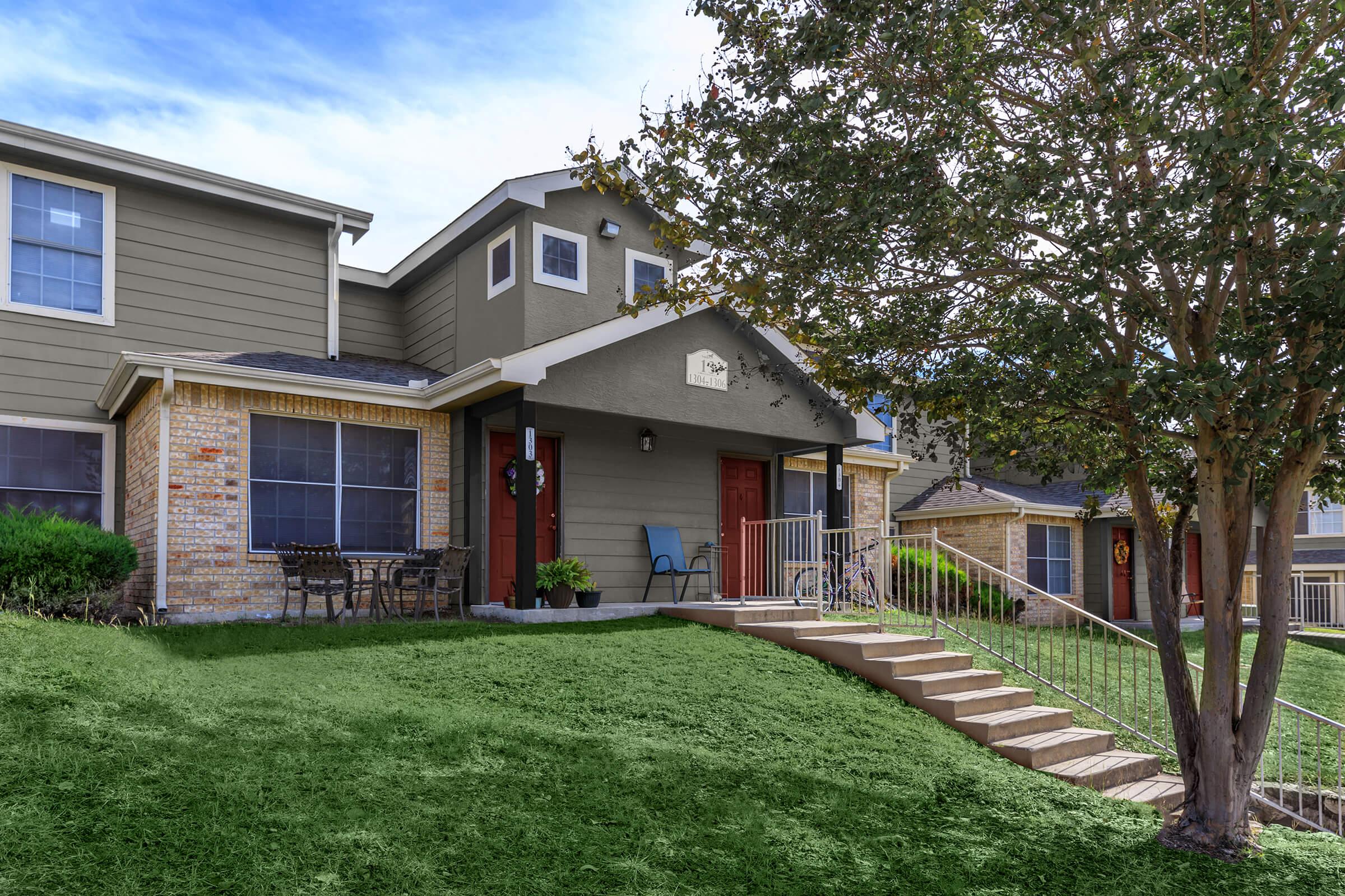 a large lawn in front of a house