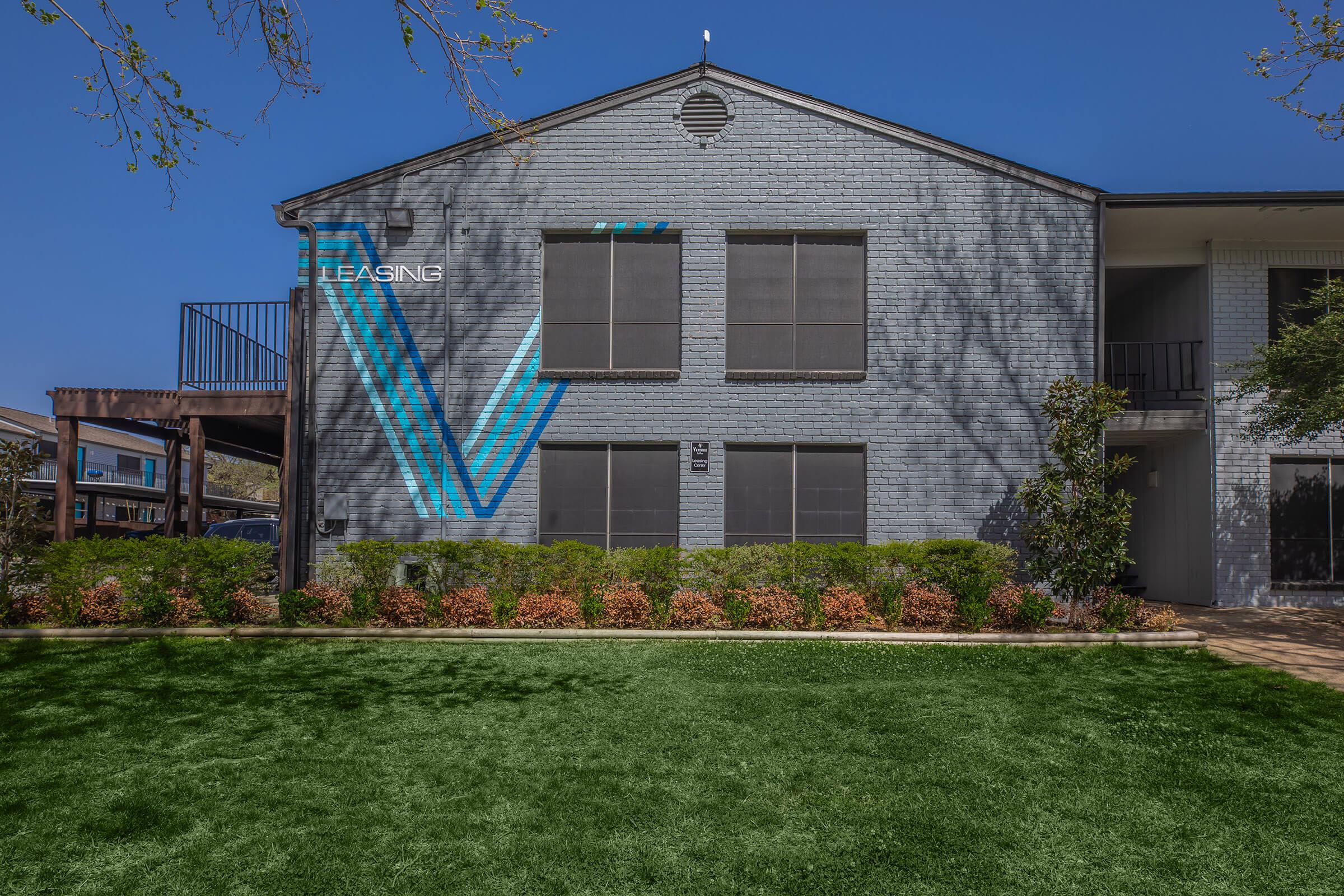 a large lawn in front of a house