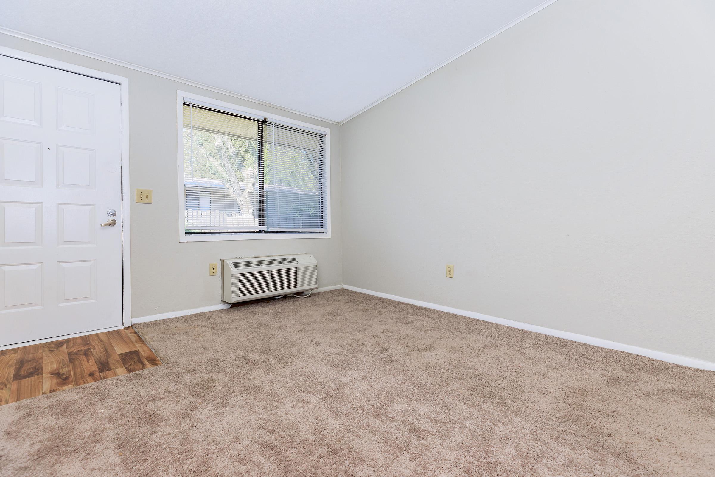 a bedroom with a large window