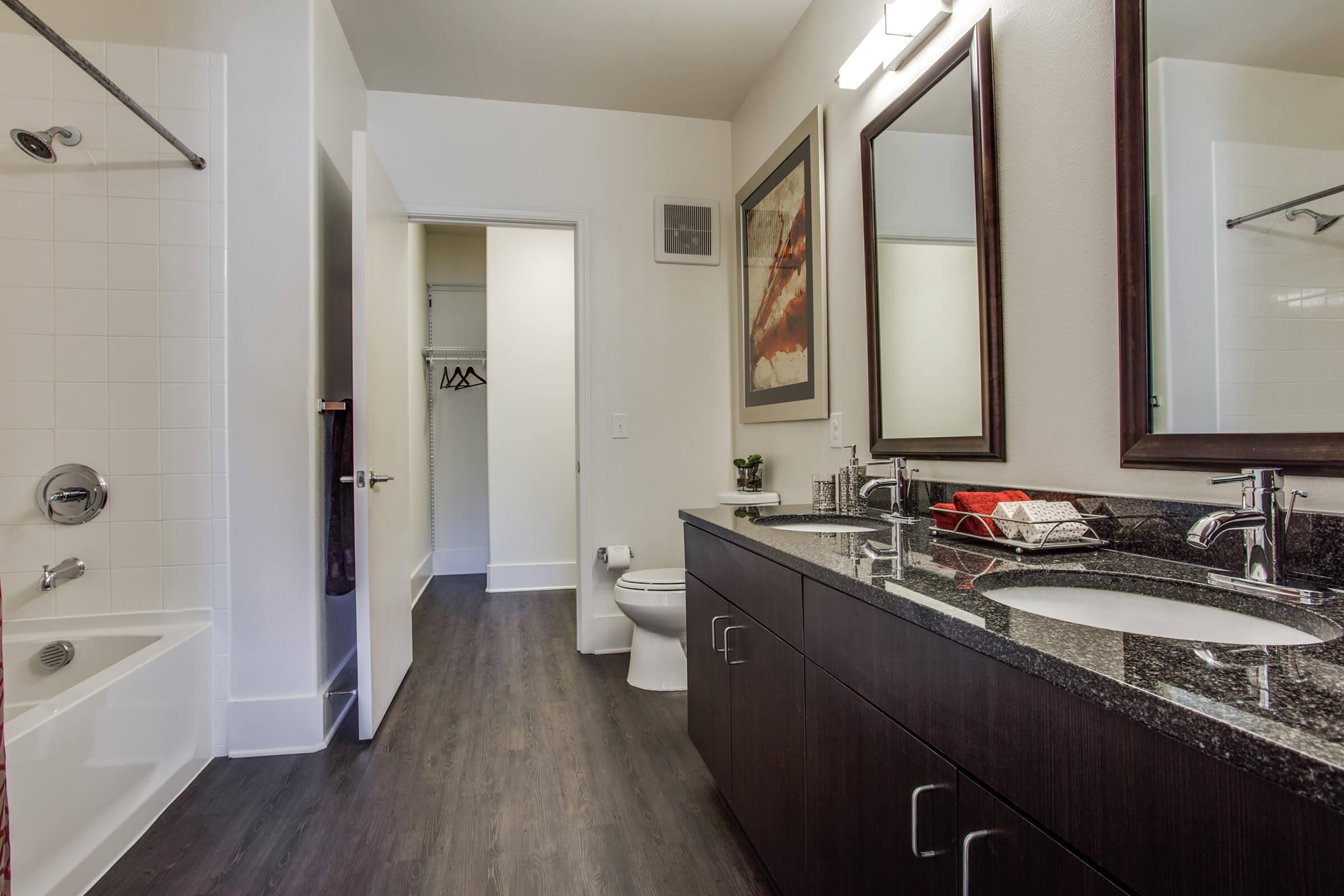 furnished bathroom with wooden floors