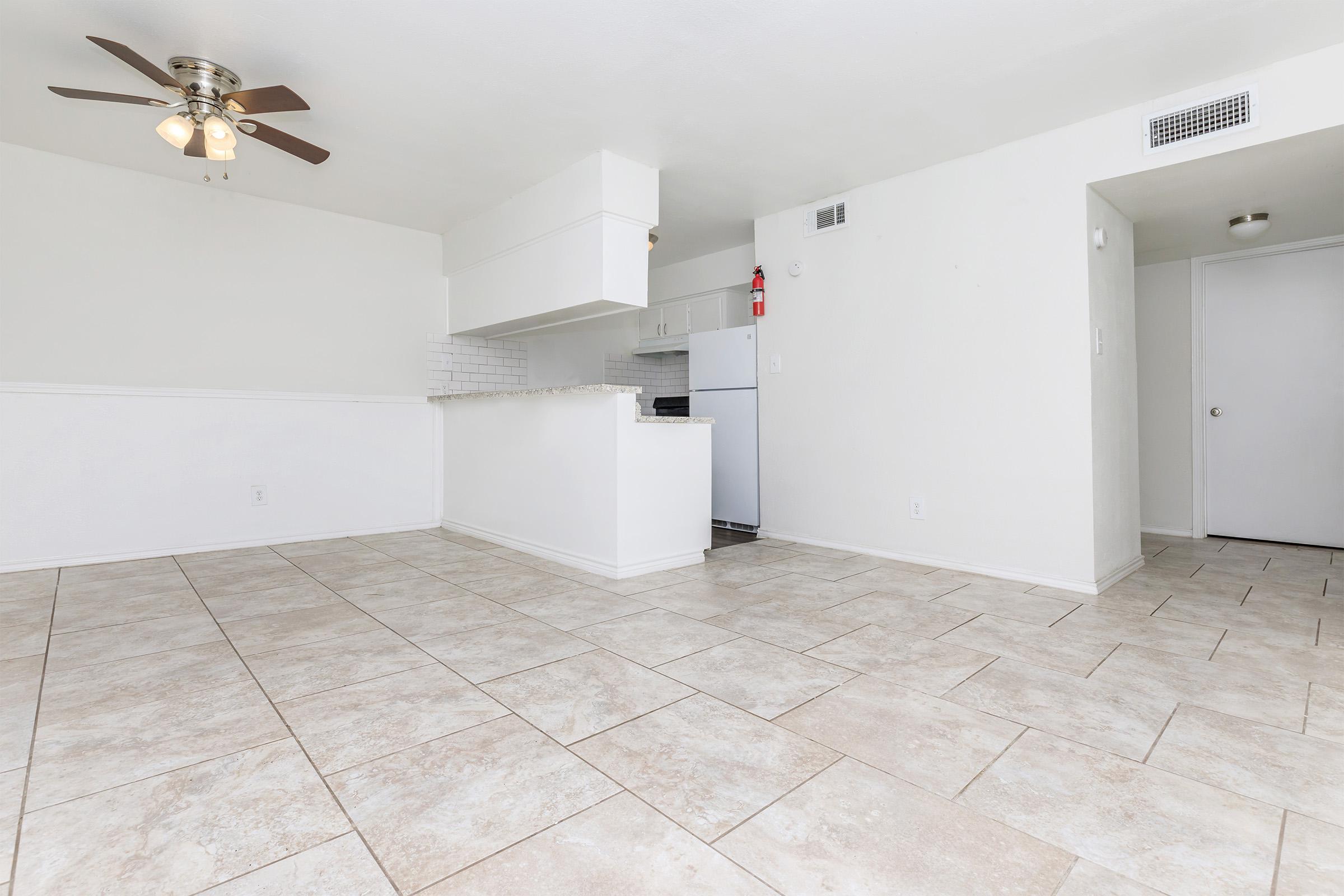 a large white refrigerator in a kitchen