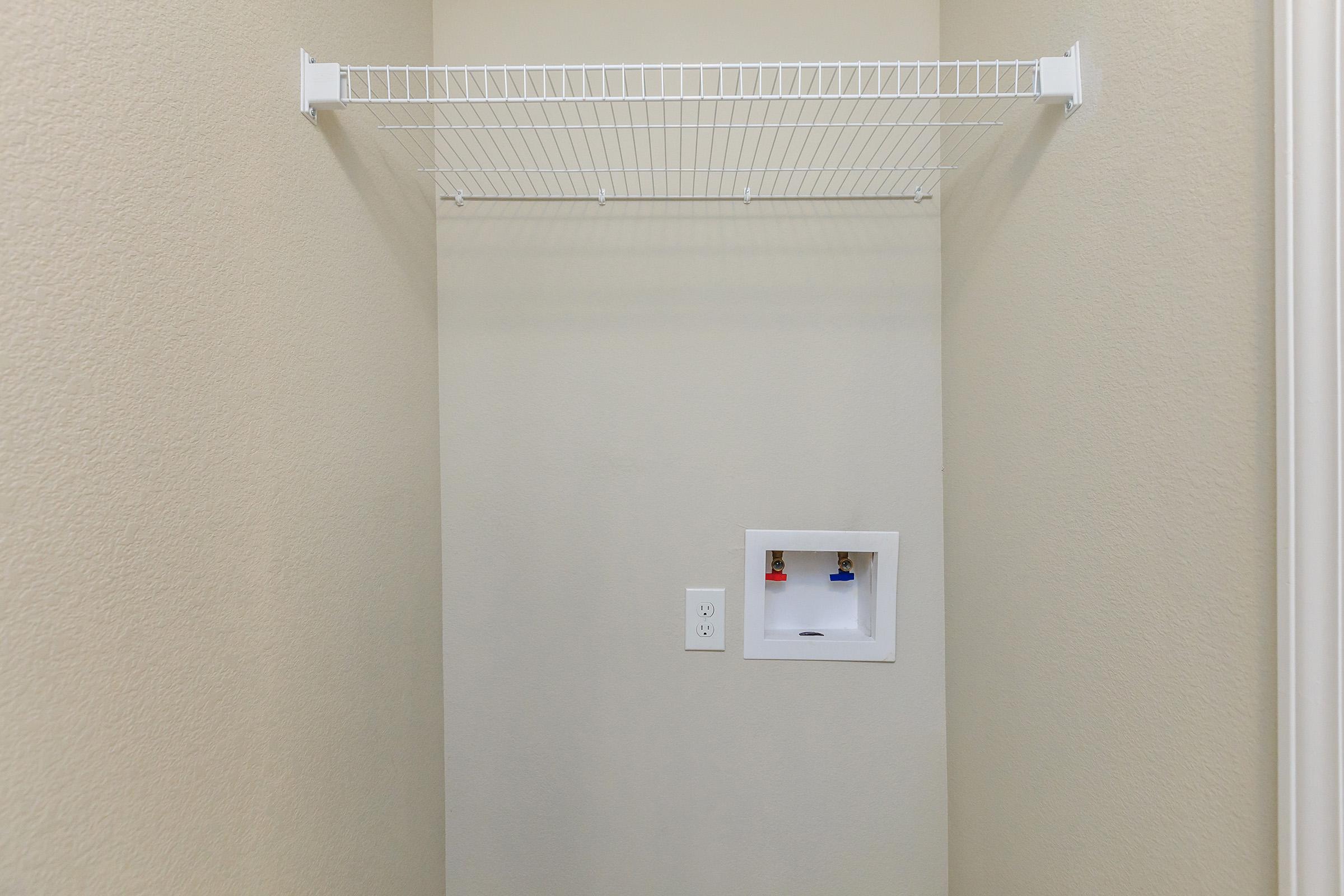 a white refrigerator freezer sitting in a room