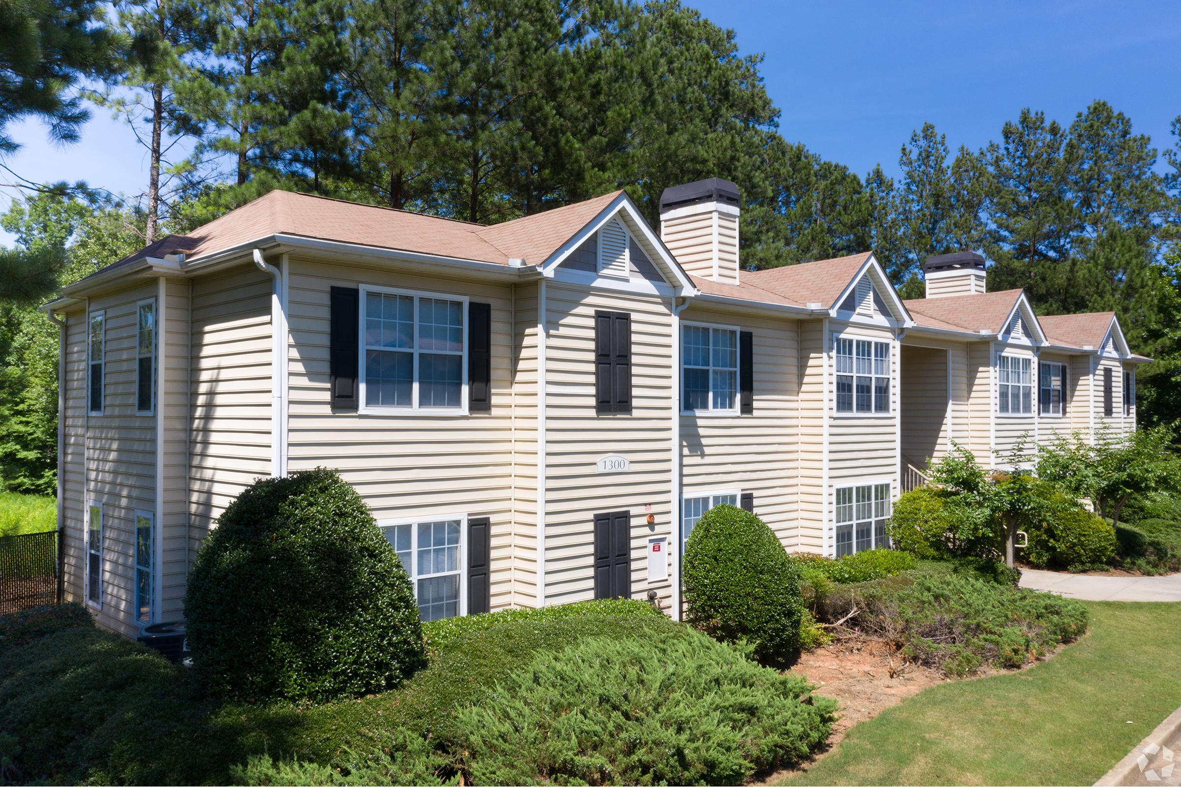 a house with trees in the background