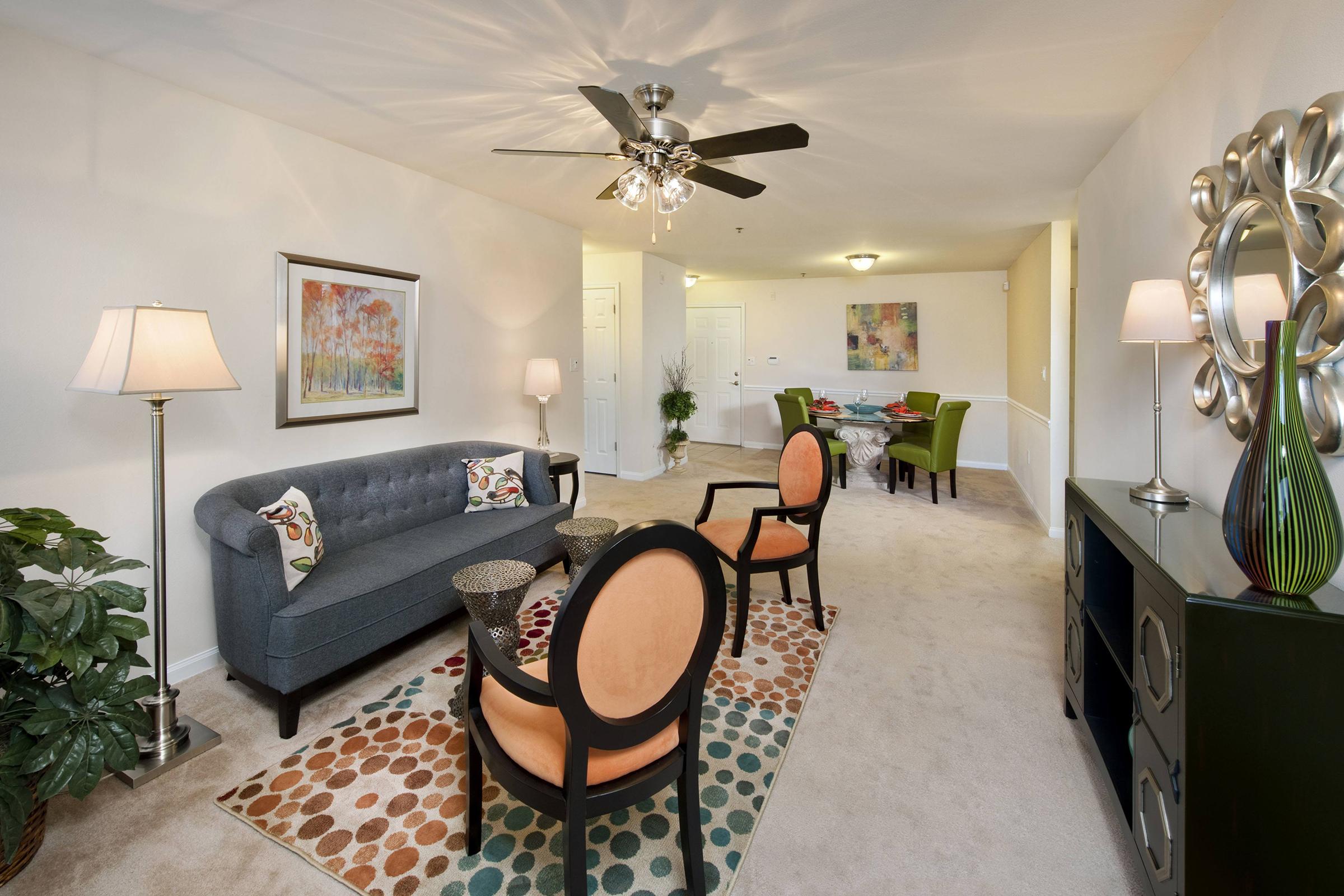 a living room filled with furniture and a rug