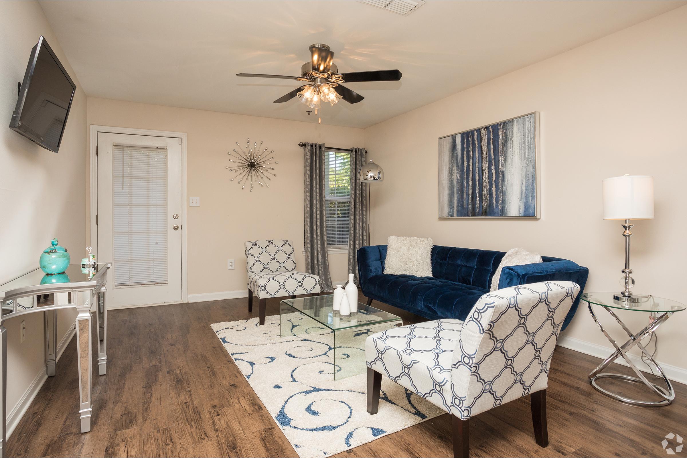 a living room filled with furniture and a rug