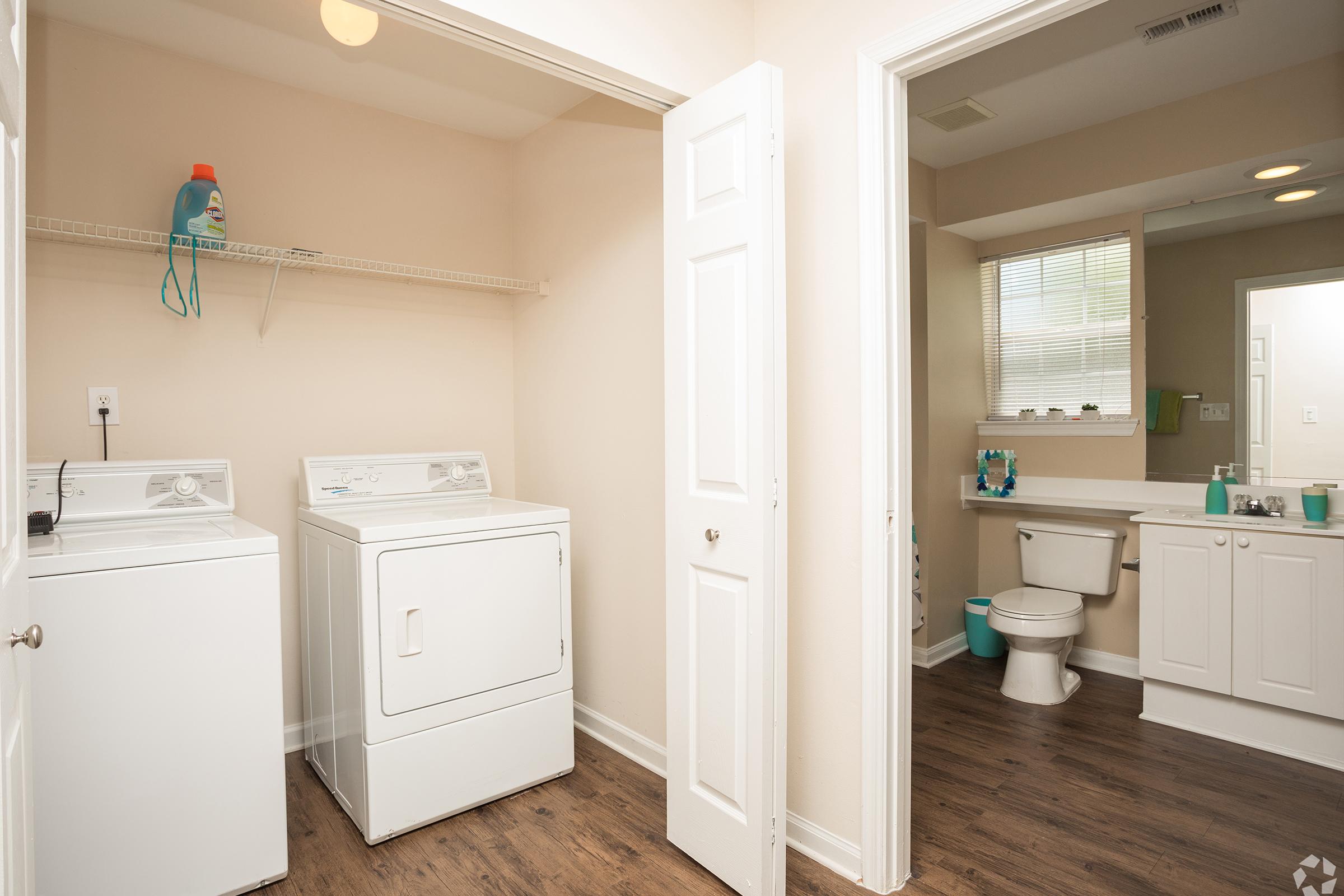 a room with a sink and a refrigerator