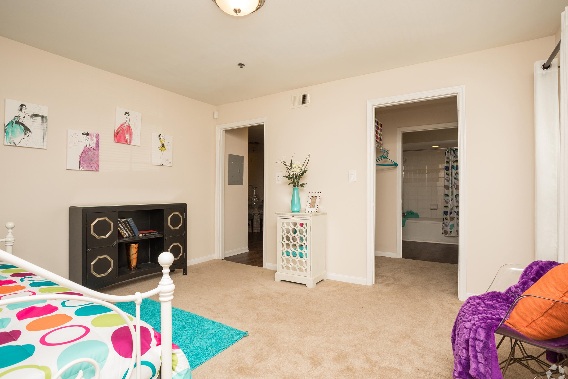 a living room with a colorful rug