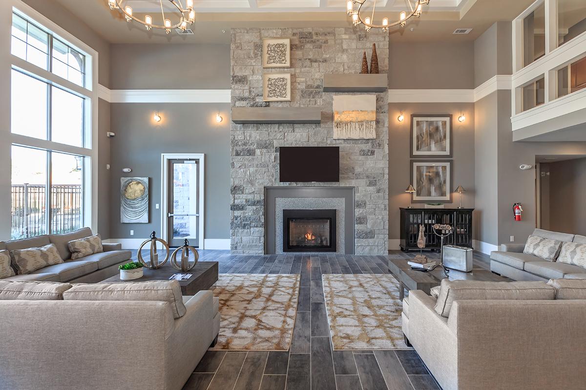 a living room filled with furniture and a fire place