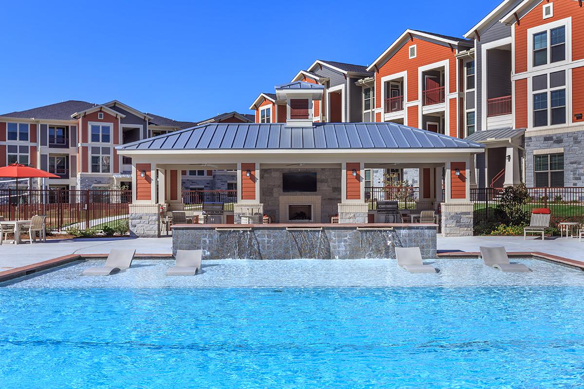 a house with a large pool of water