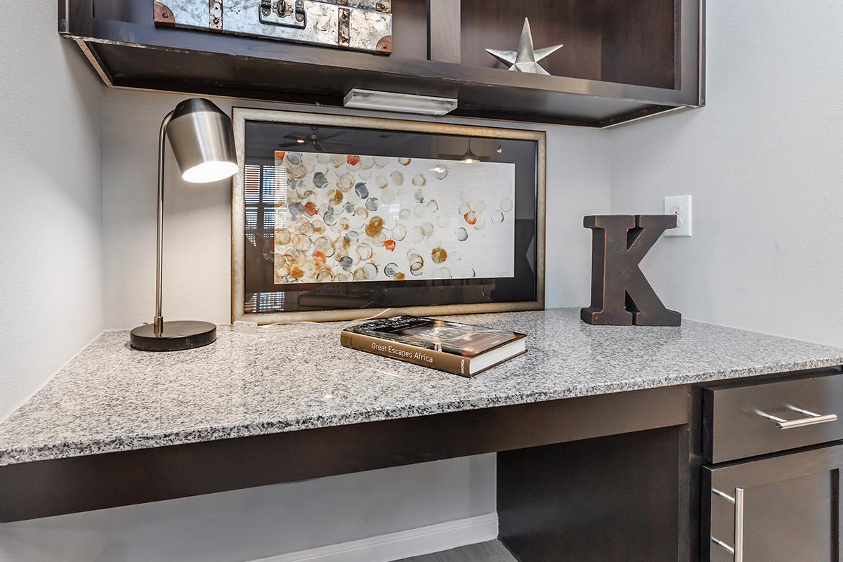 a kitchen with a sink and a mirror