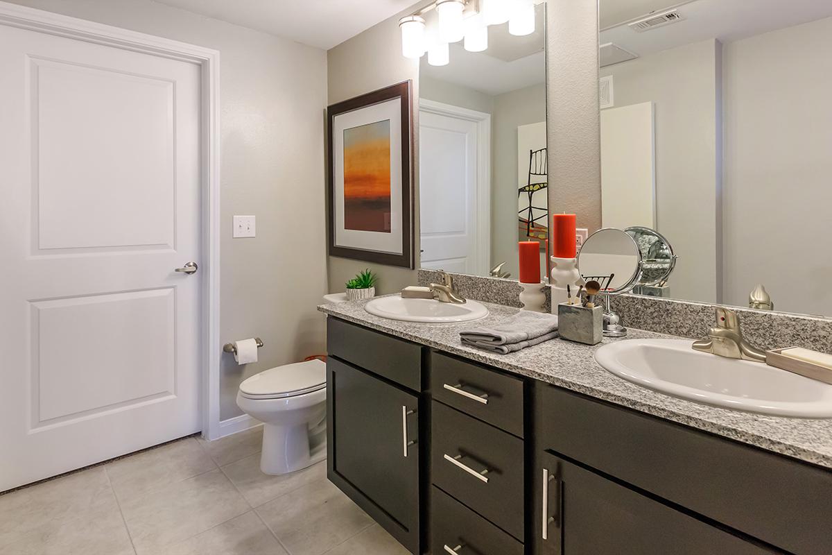 a kitchen with a sink and a mirror