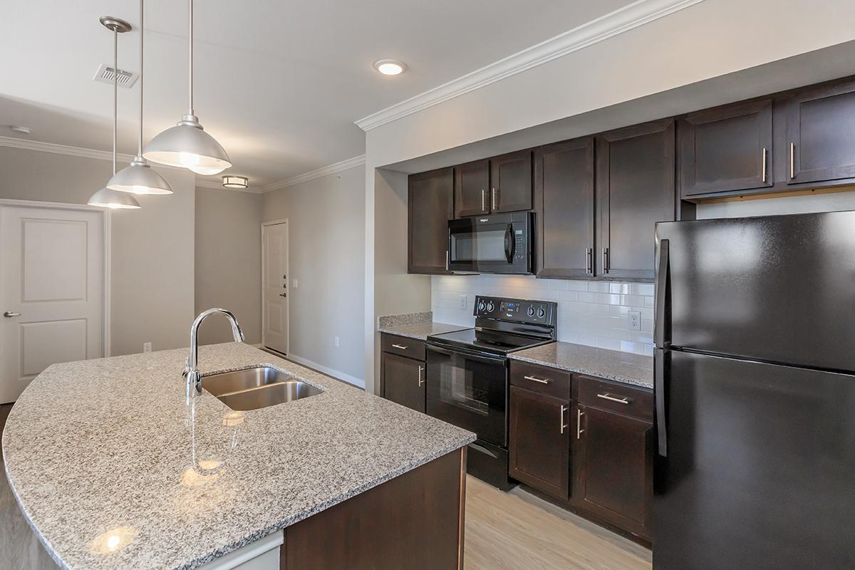 a modern kitchen with stainless steel appliances