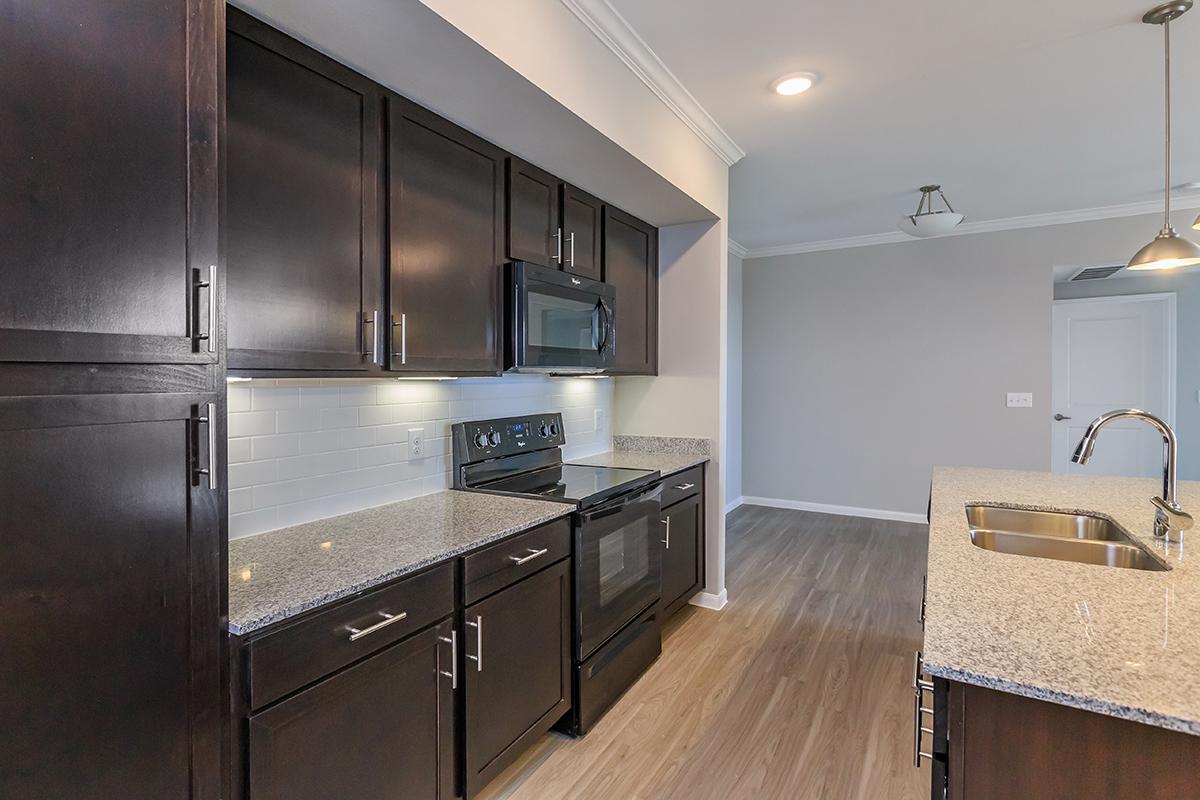 a large kitchen with stainless steel appliances