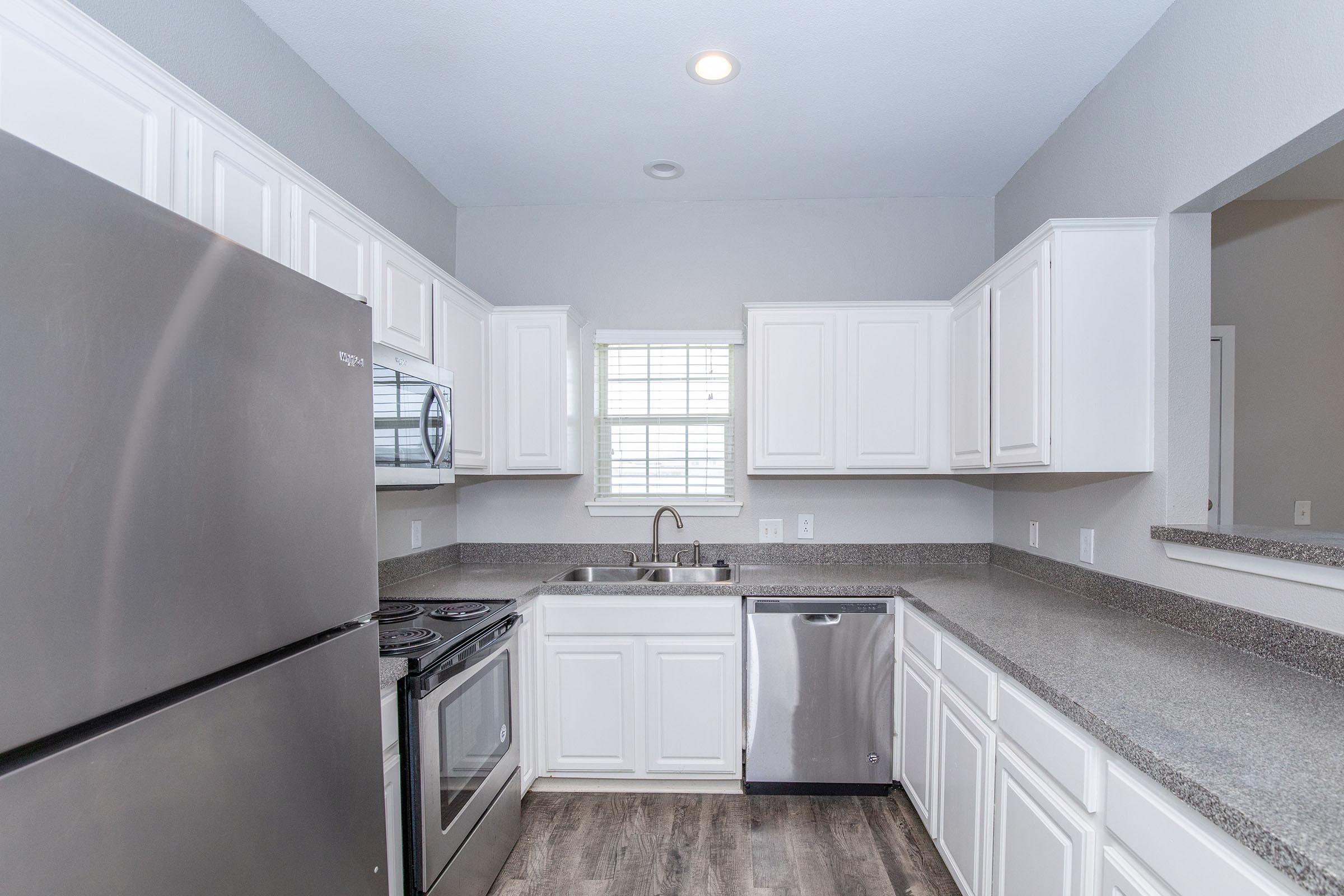 a stainless steel refrigerator in a kitchen