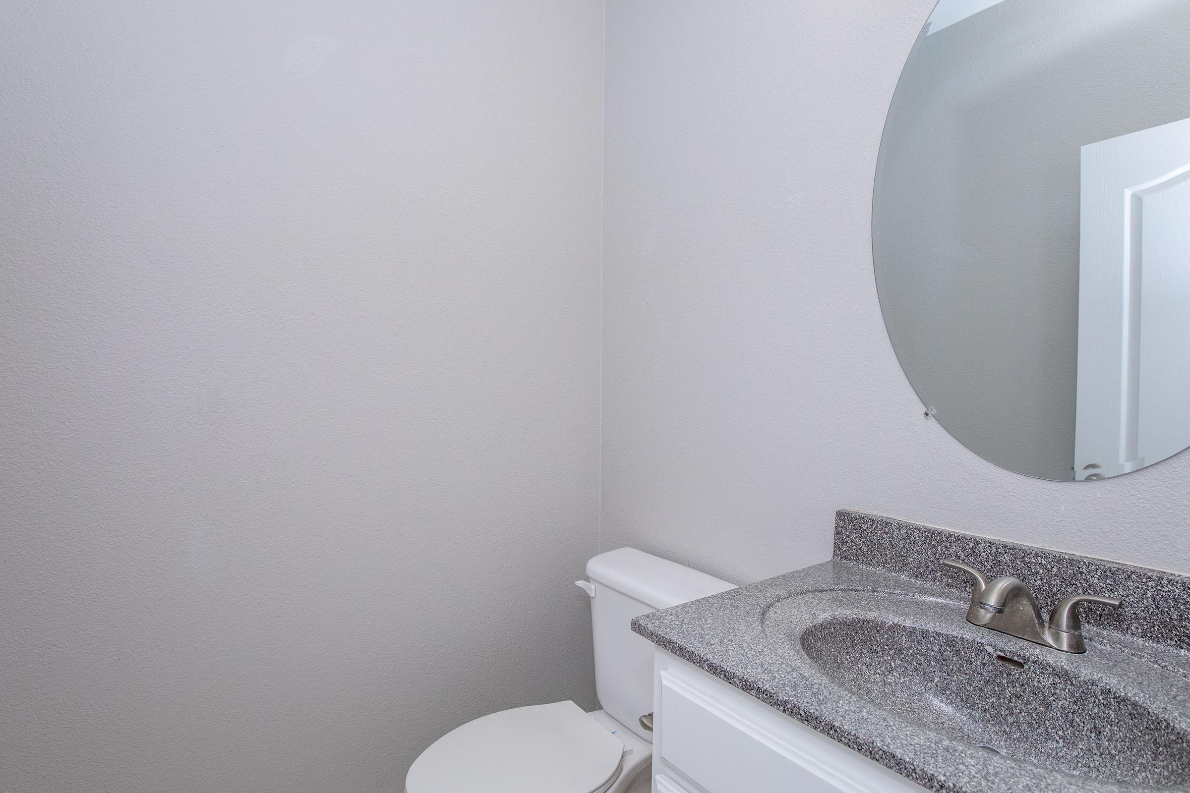 a close up of a sink and a mirror