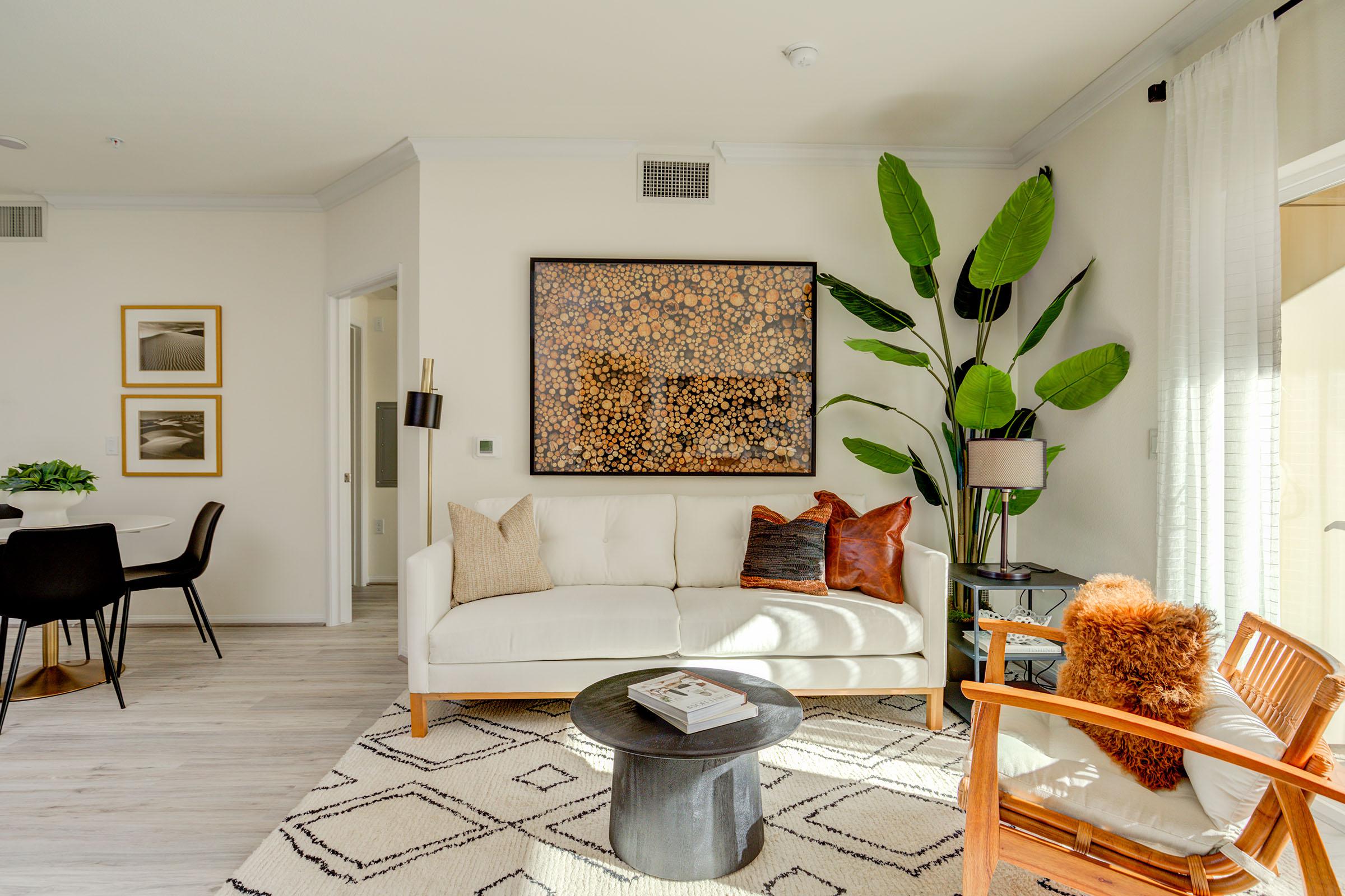 a living room filled with furniture and a fireplace