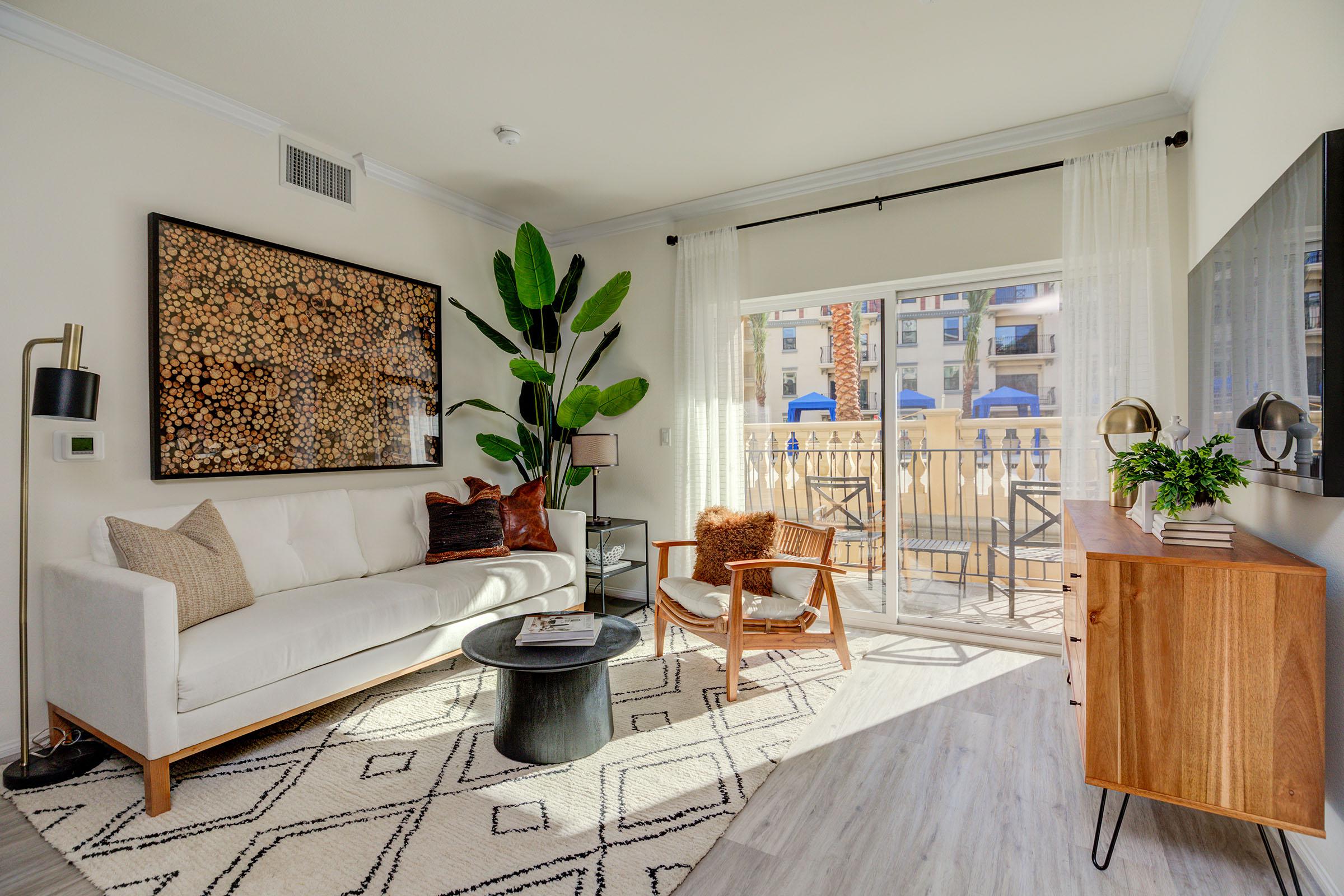 a living room filled with furniture and a fire place