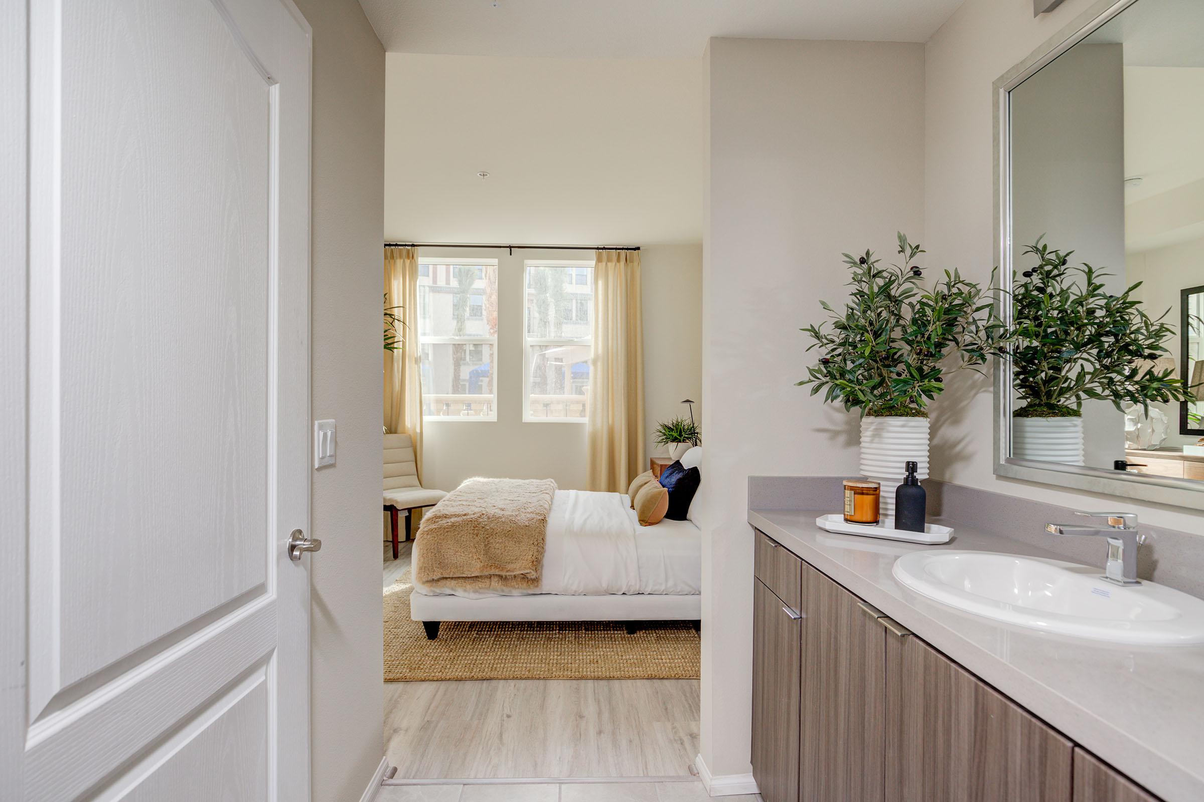 a kitchen with a sink and a mirror