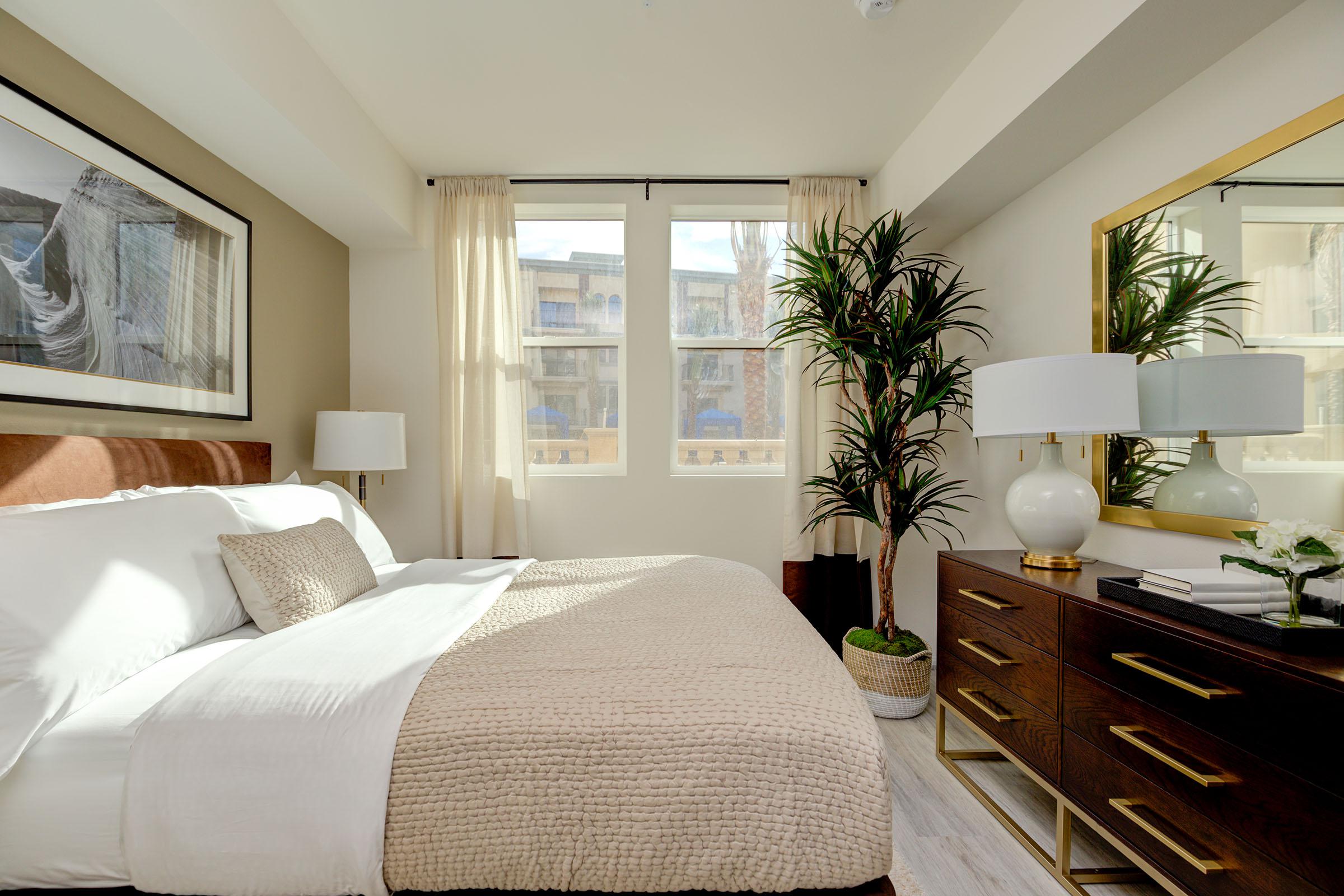 a bedroom with a large bed in a hotel room