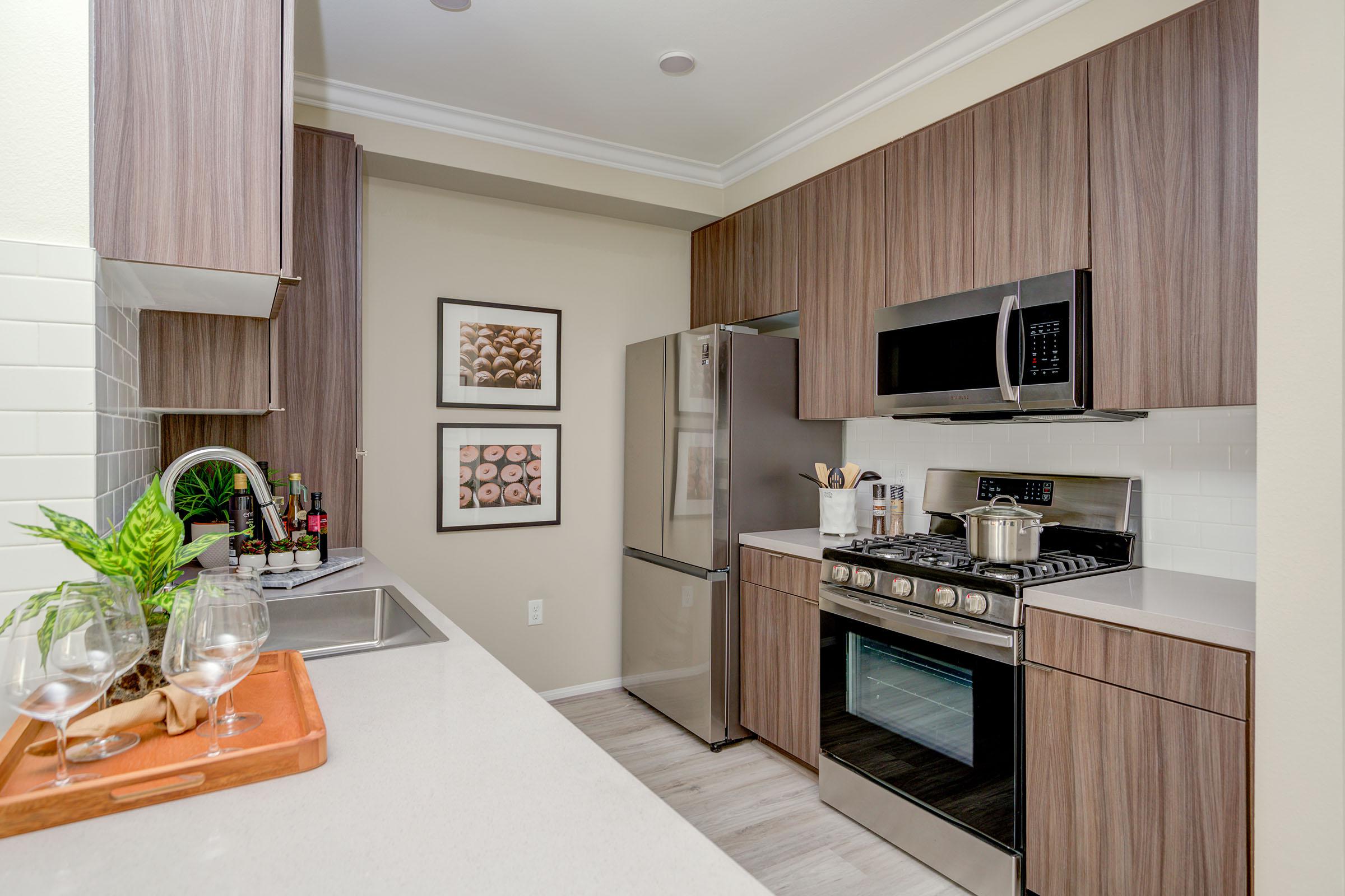 a kitchen with a sink and a microwave