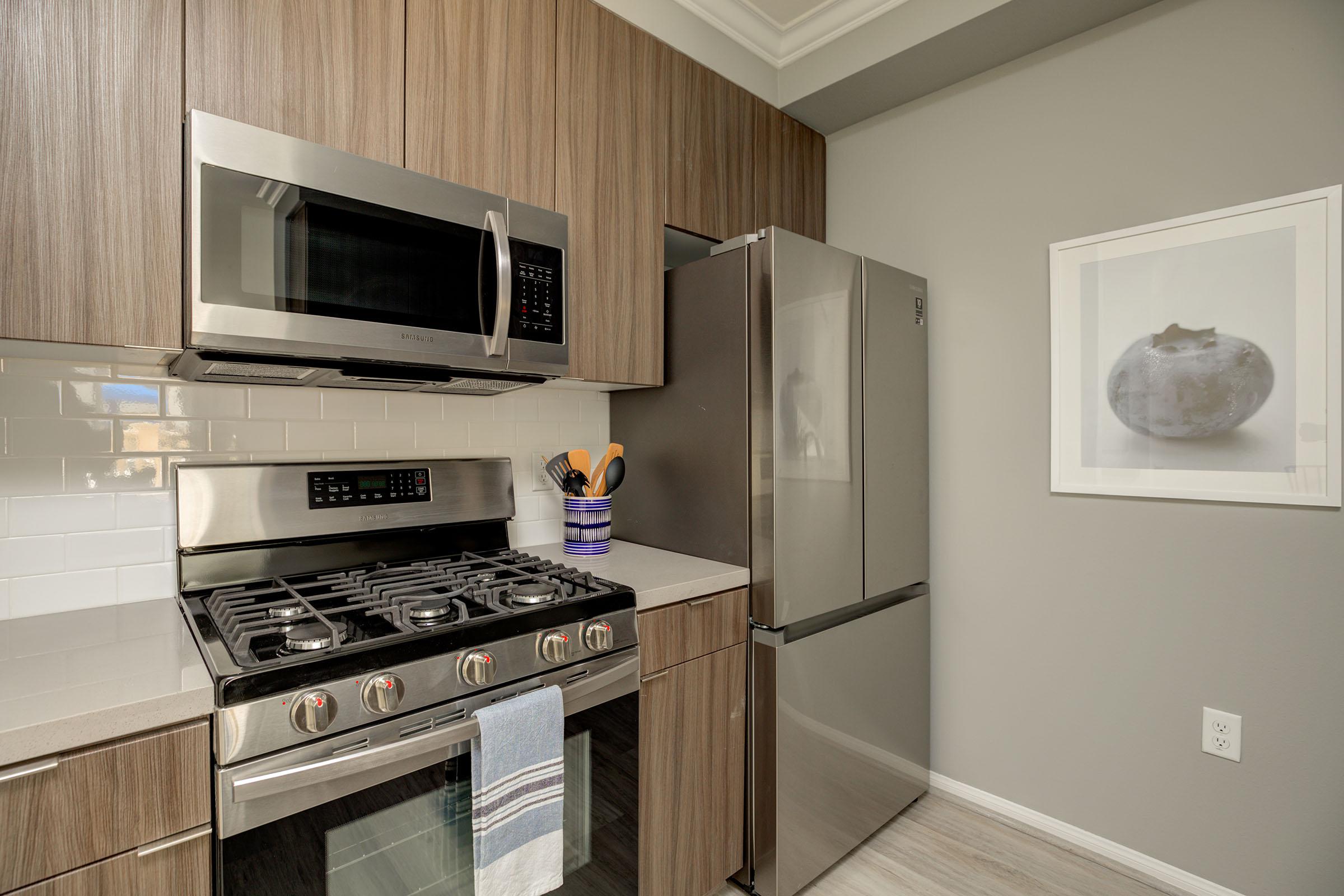 a kitchen with a stove top oven sitting inside of a microwave