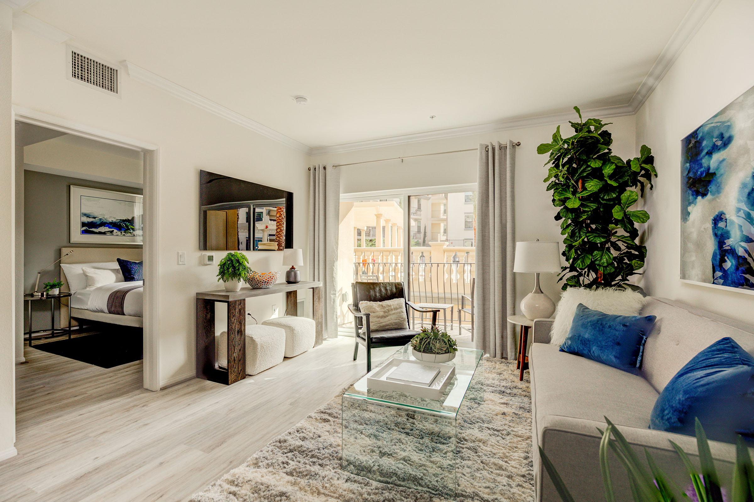 a living room filled with furniture and a fireplace