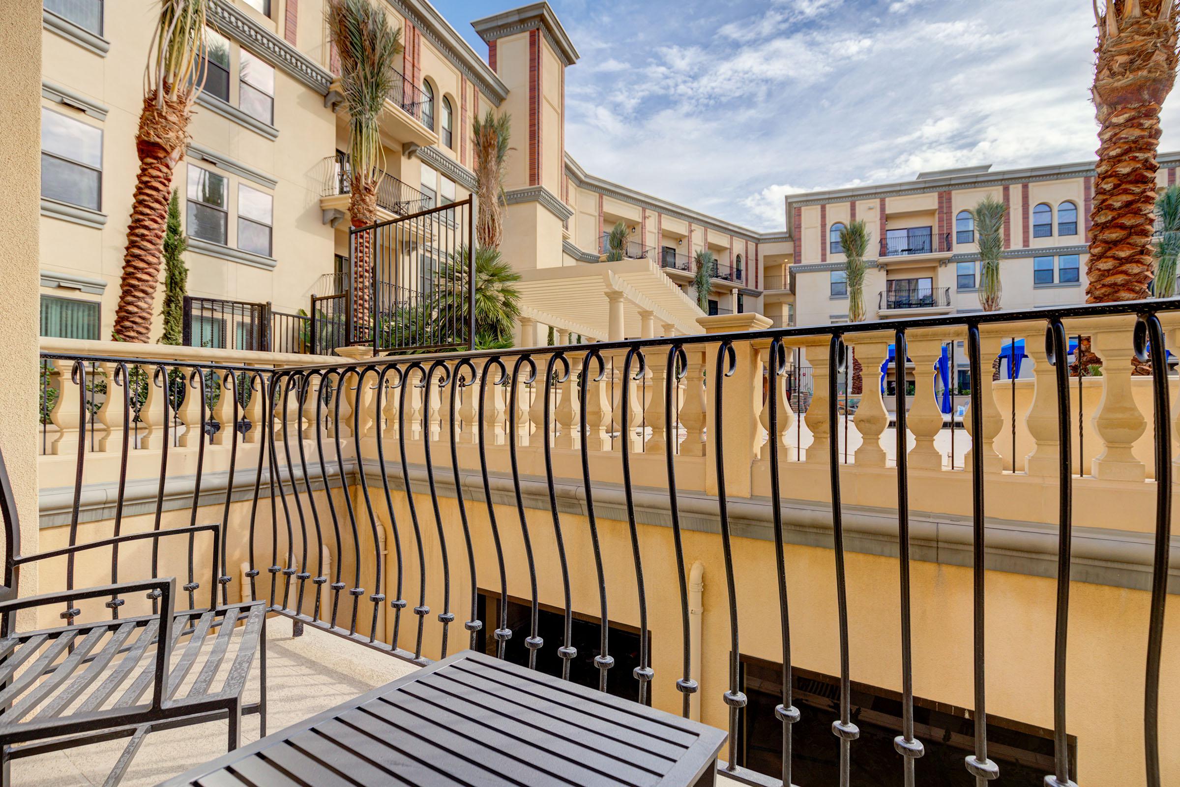 a row of wooden benches sitting on top of a building