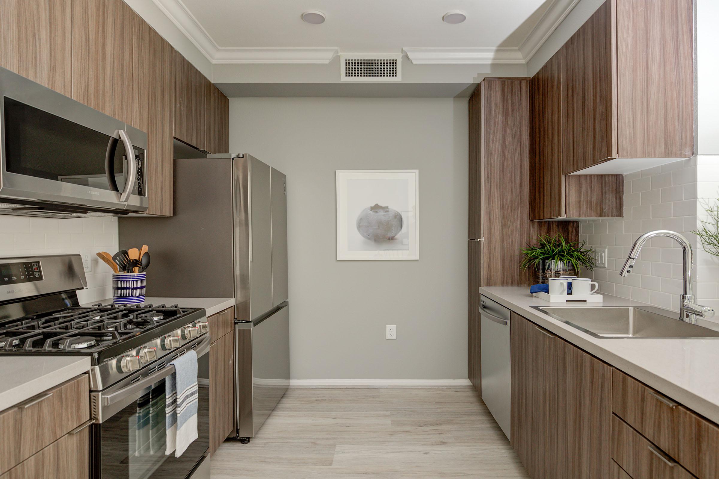 a kitchen with a stove and a sink