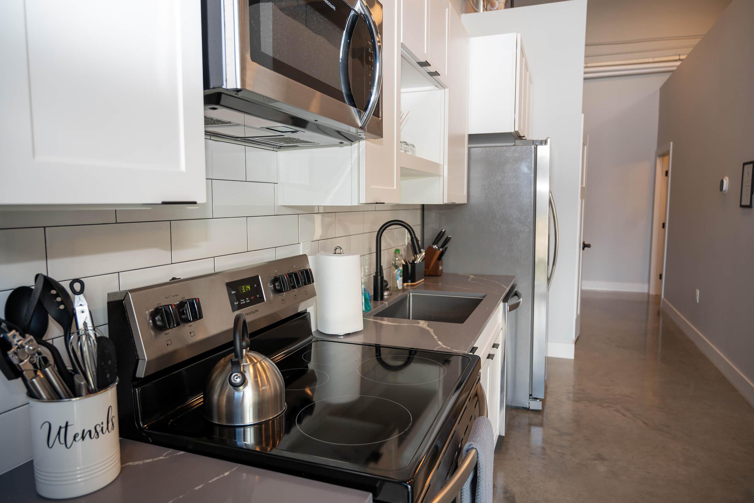 a kitchen with a sink and a microwave