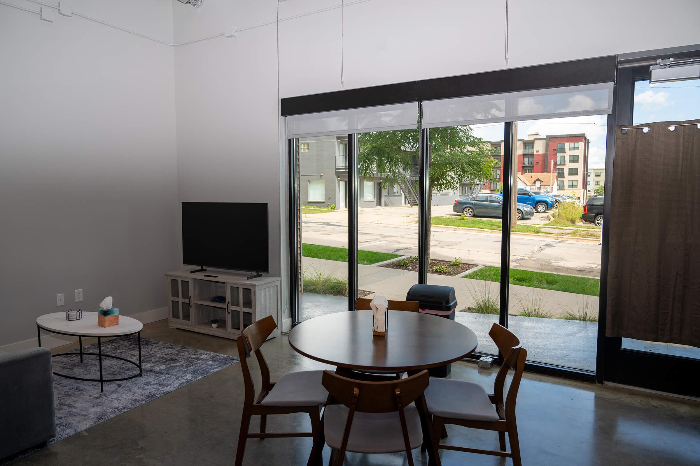 a dining room table in front of a window